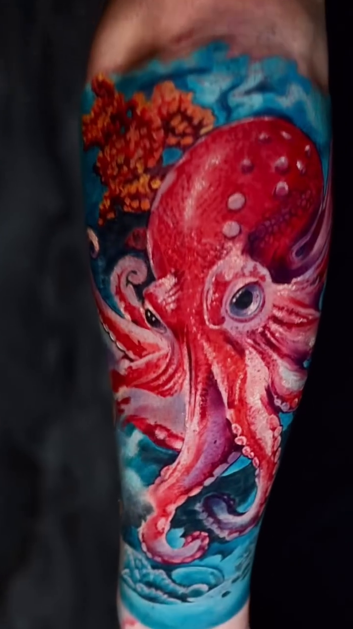 Octopus in coral reef realism tattoo by Tattoos By Chino