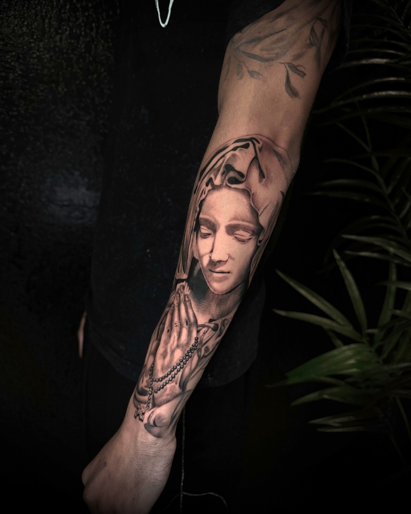 Praying hands with face realism tattoo on the forearm by Chip