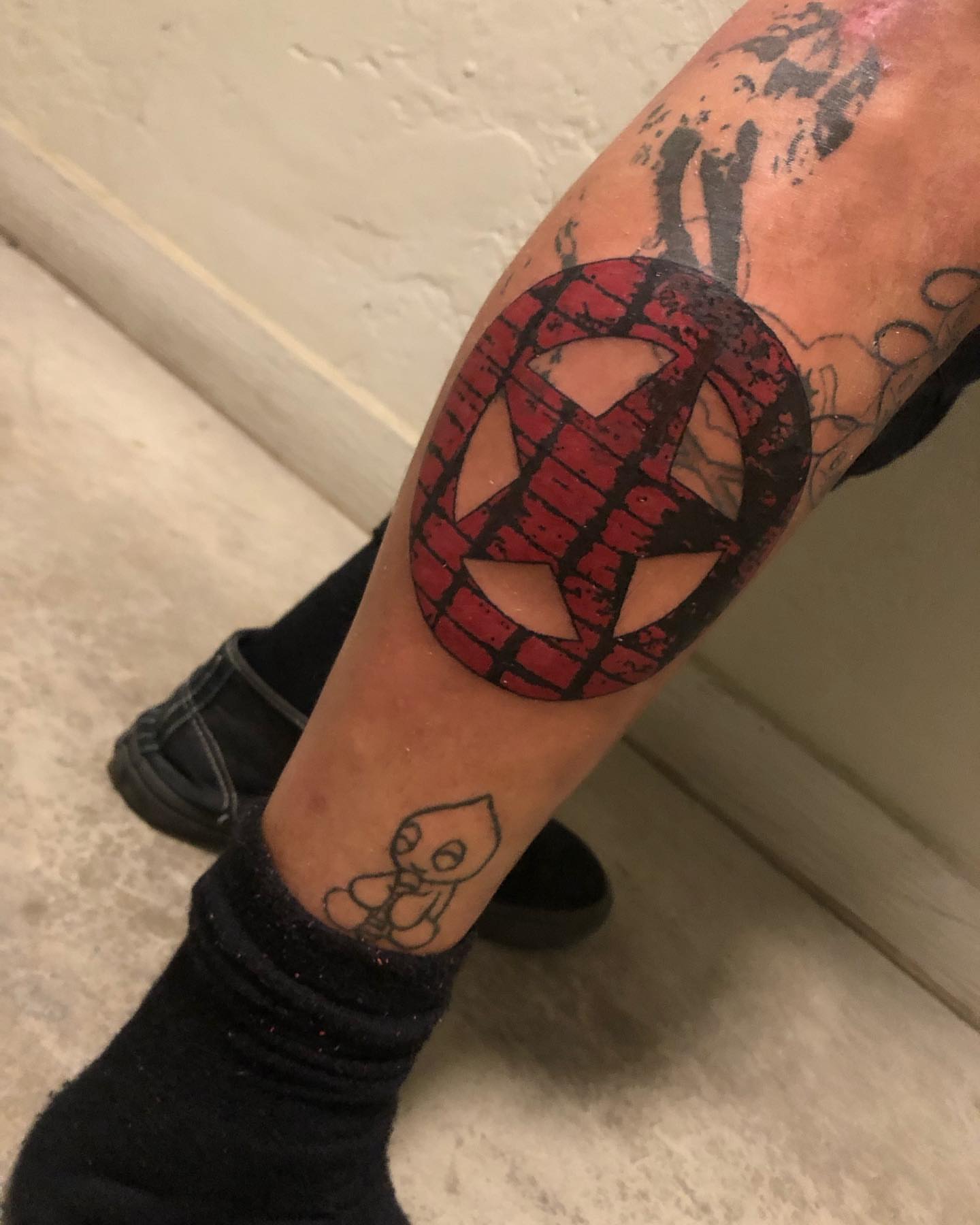 Mask geometric tattoo on the forearm by @emotionalthugtattoo