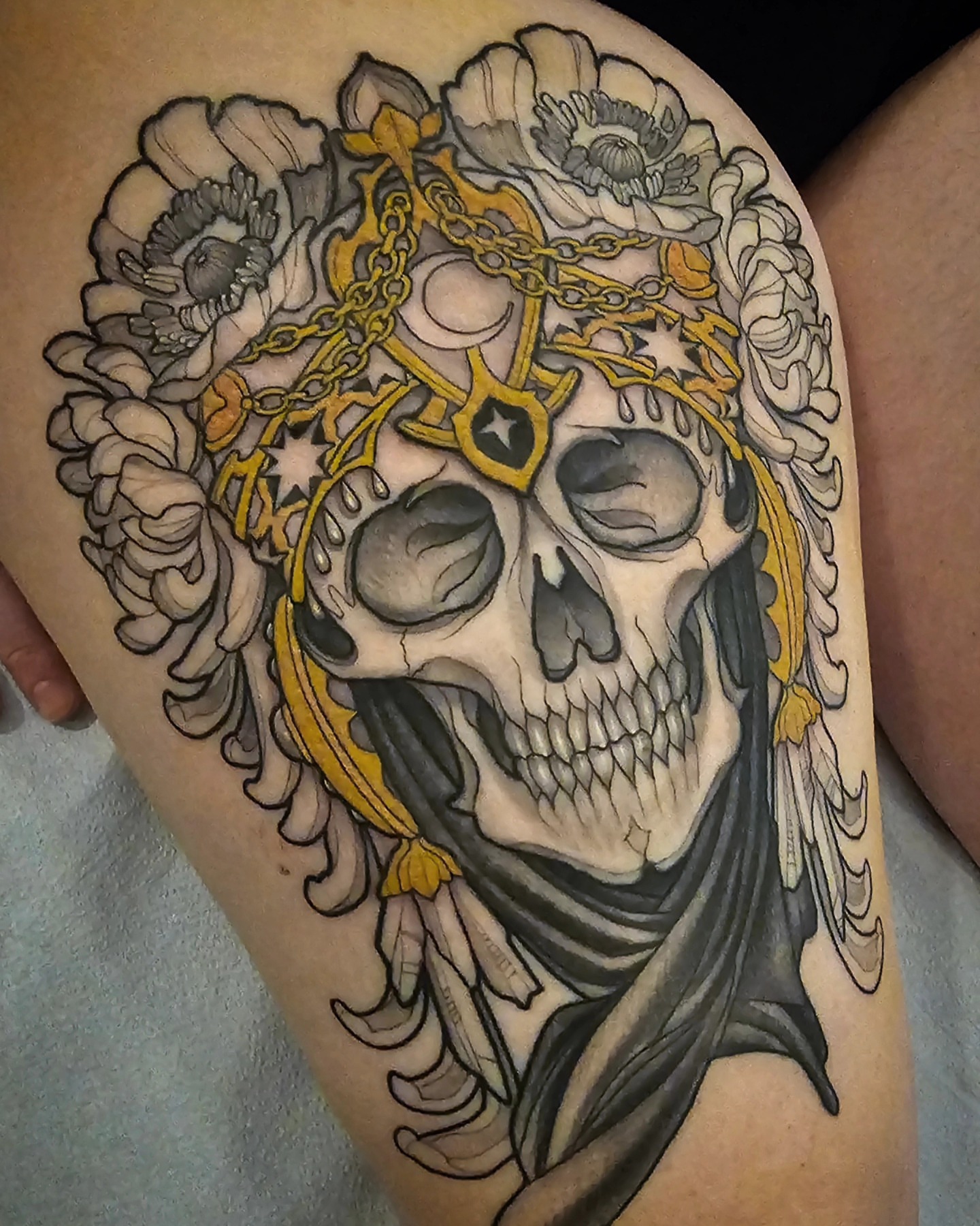 Skull with floral crown American traditional tattoo on the thigh by Robert Kraiza - Philadelphia Tattoo Artist