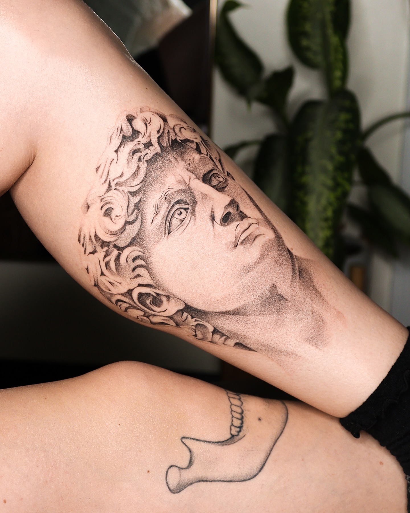 Statue head realism tattoo on the forearm by Beans