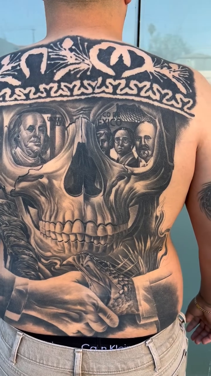 Skull with portraits and hands realism tattoo by Antonio Pavić, Los Angeles, California