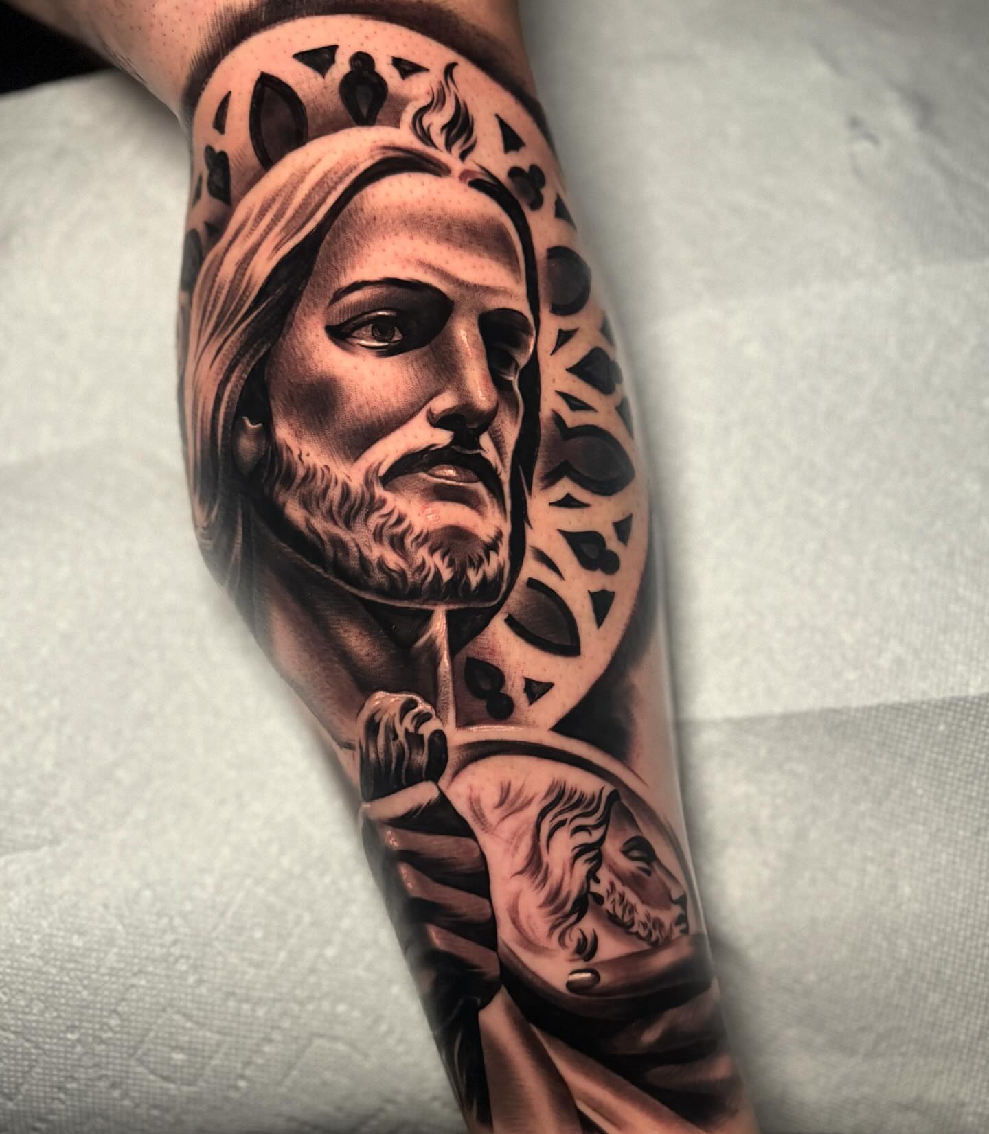 Religious figure black and grey tattoo on the forearm by eksoe_