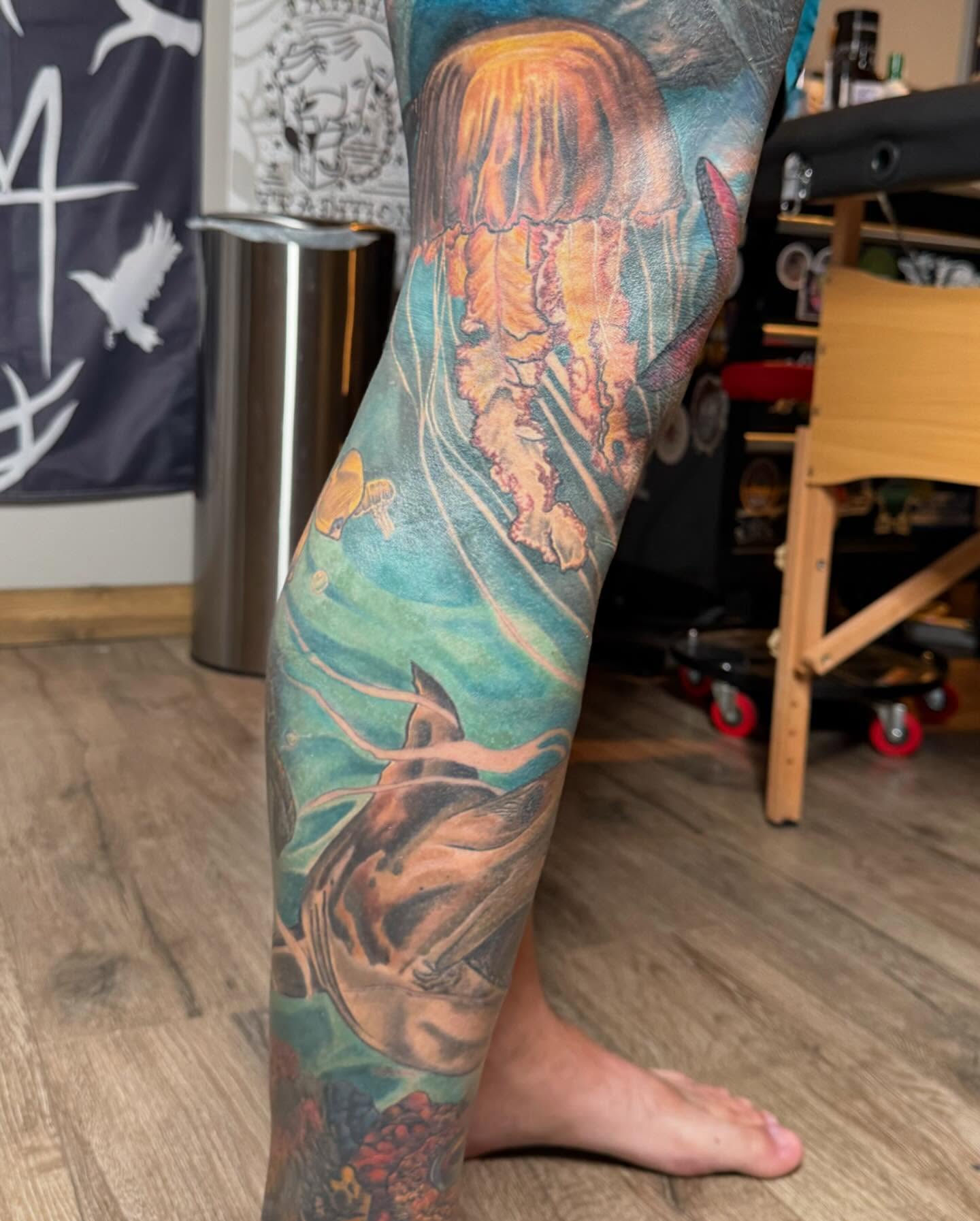 Underwater scene with jellyfish and shark Japanese tattoo on the leg by Aaron Ysidro