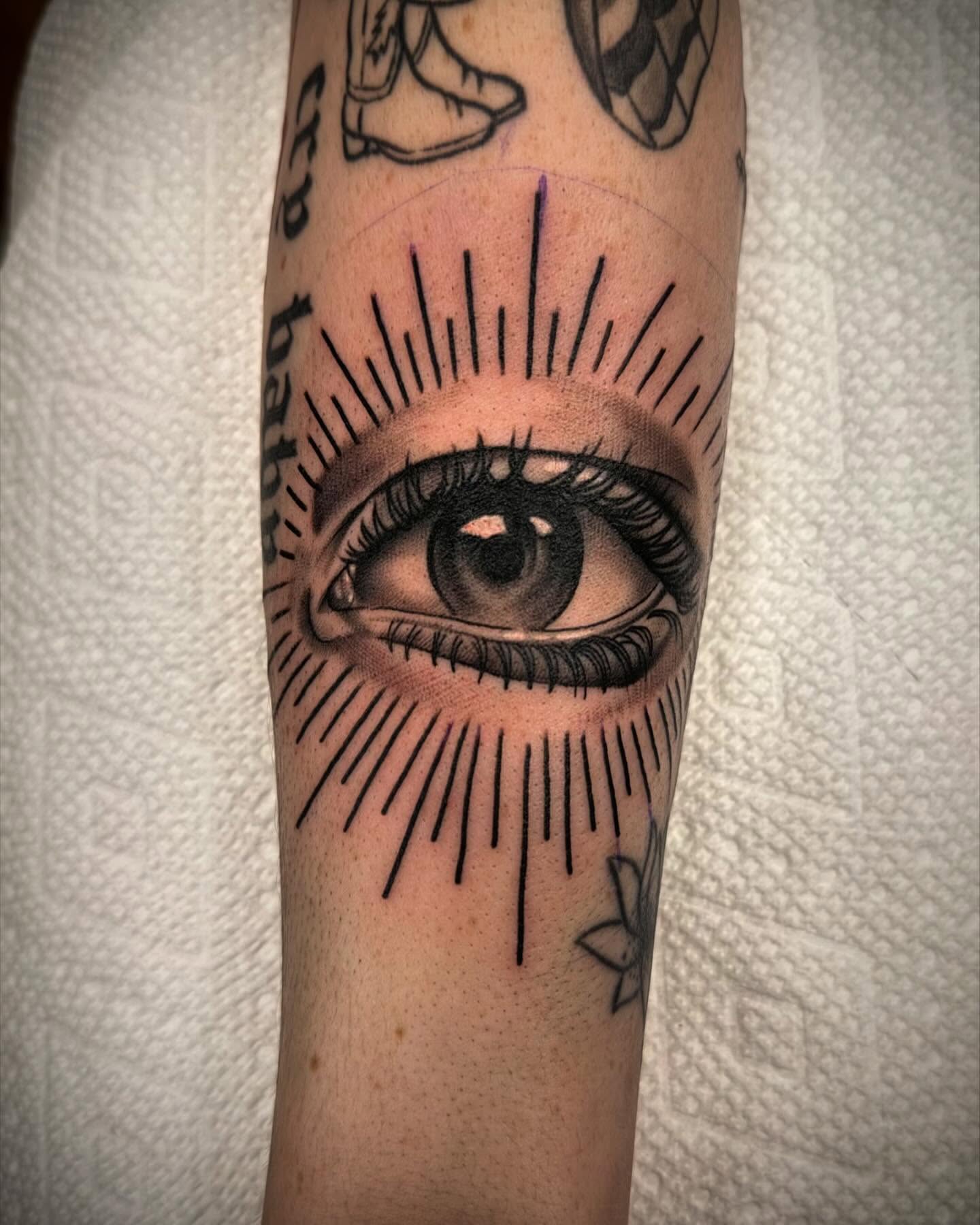 Eye realism tattoo on the forearm by Sam Babcock