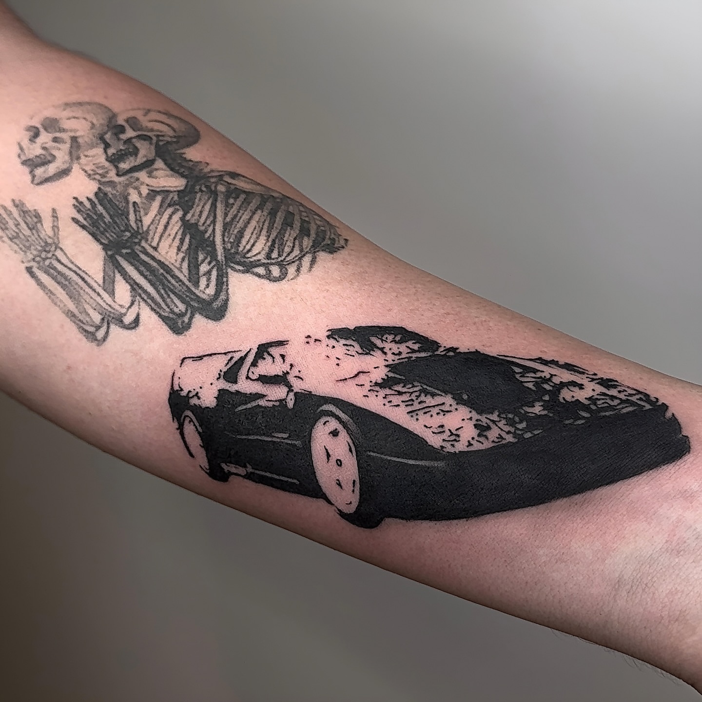 Car crash black and grey tattoo on the forearm by V เผ๏ธ ๐๐๐ญ๐ญ๐จ๐จ ๐๐ซ๐ญ๐ข๐ฌ๐ญ