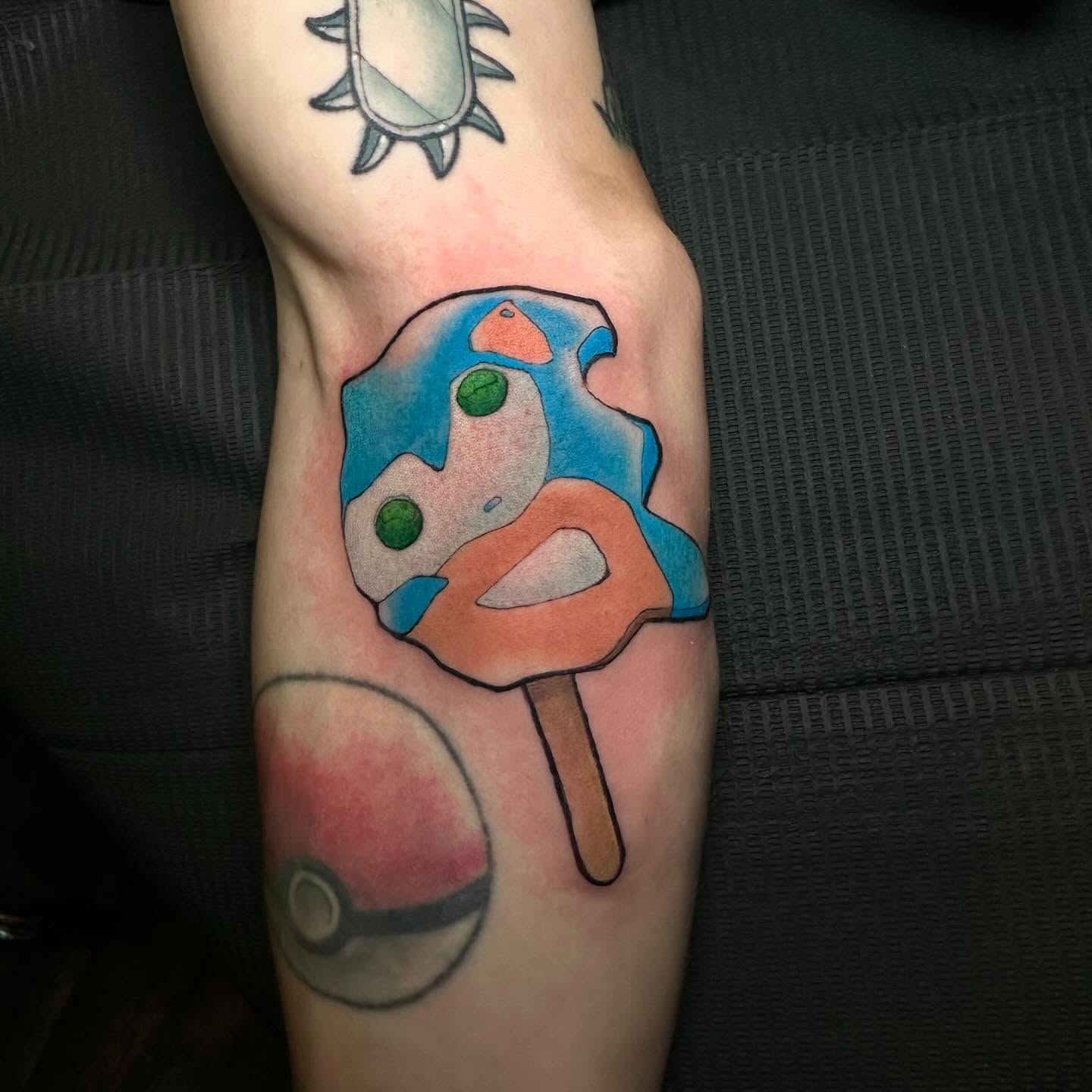 Ice cream popsicle new school tattoo on the forearm by Noel Martinez, Golden, Colorado
