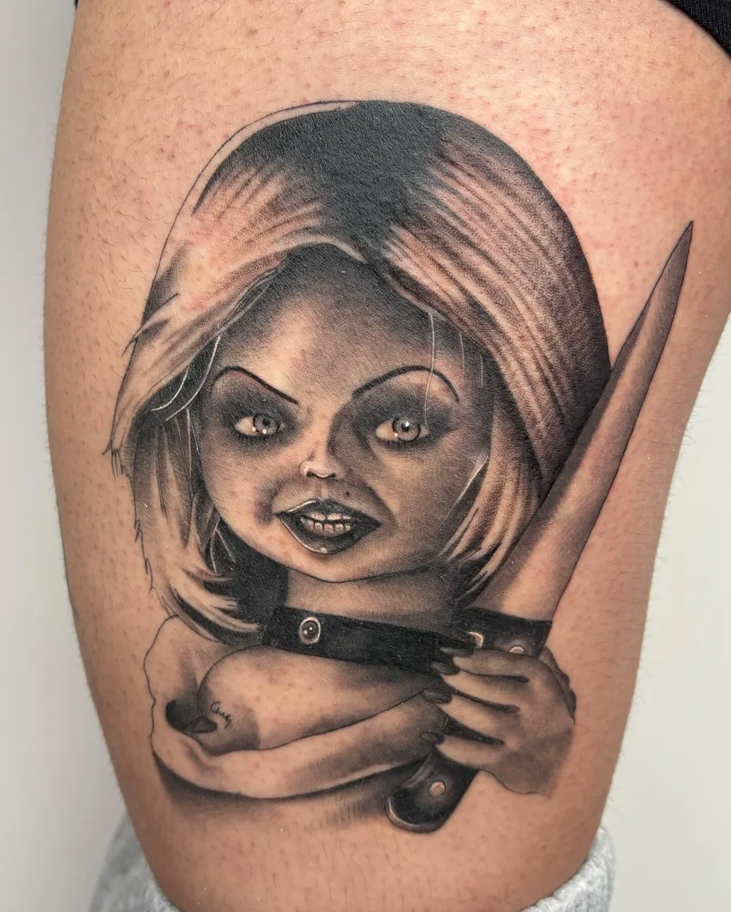 Doll with knife realism tattoo on the thigh by Savana ☆