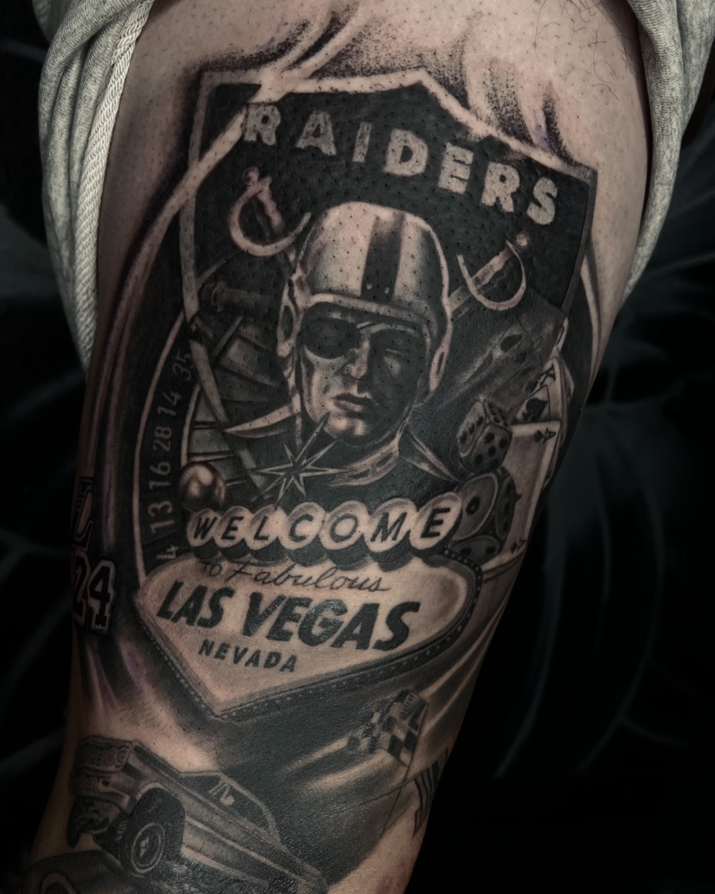 Raiders las vegas sign black and grey tattoo on the forearm by Henry Fuentes