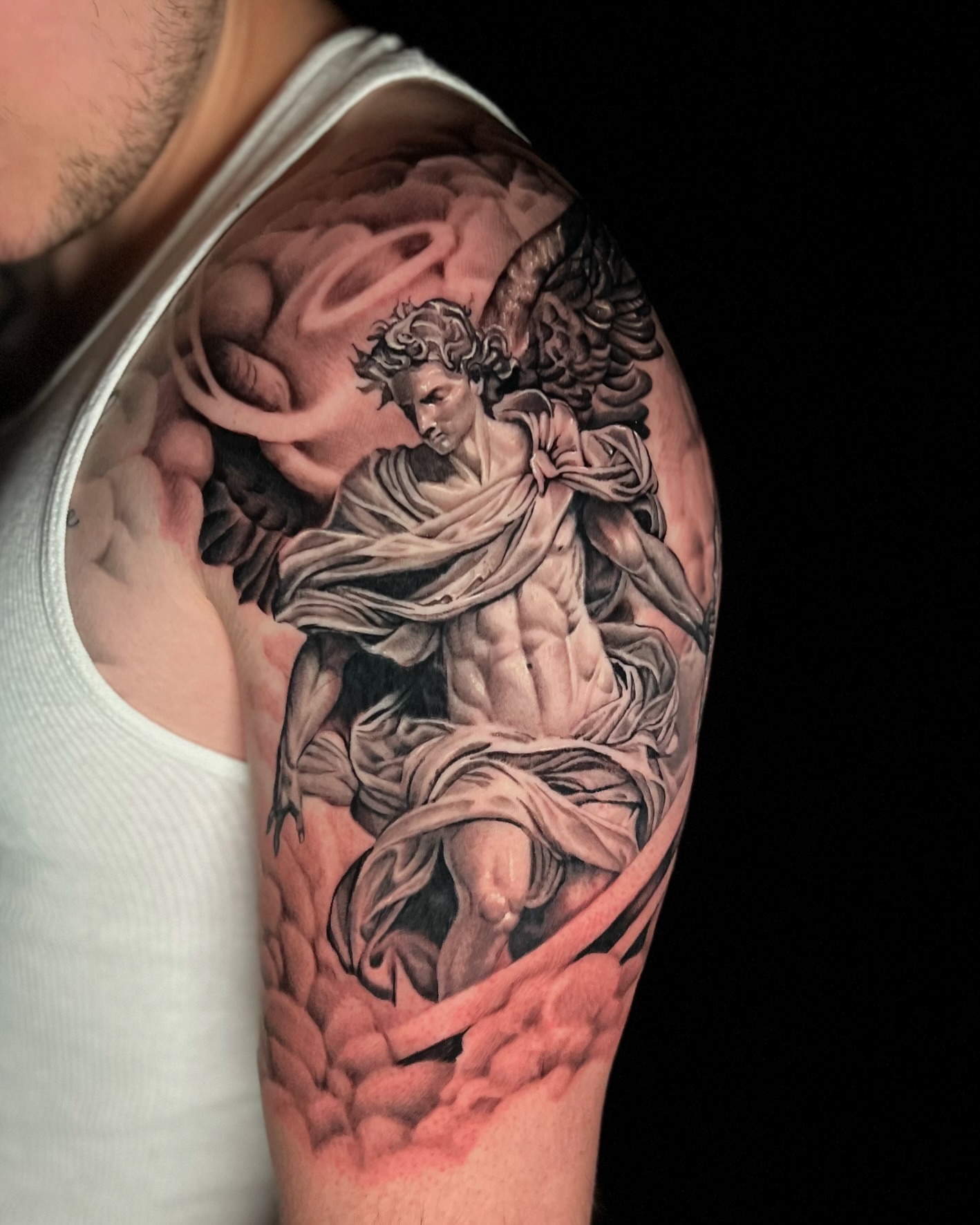 Statue of angel realism tattoo on the shoulder by Sebastian Calderon