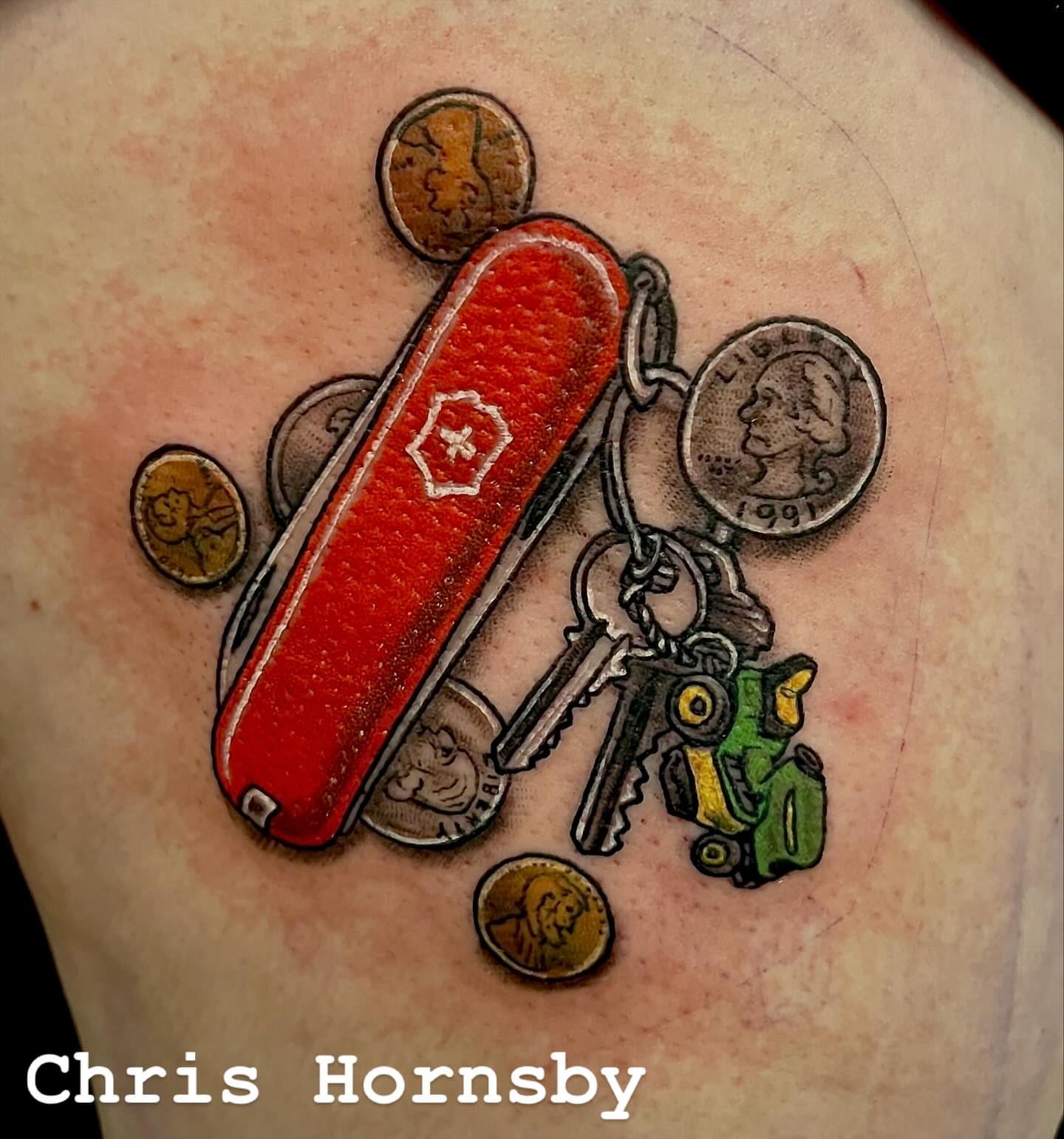 Swiss army knife realism tattoo on the forearm by Chris Hornsby