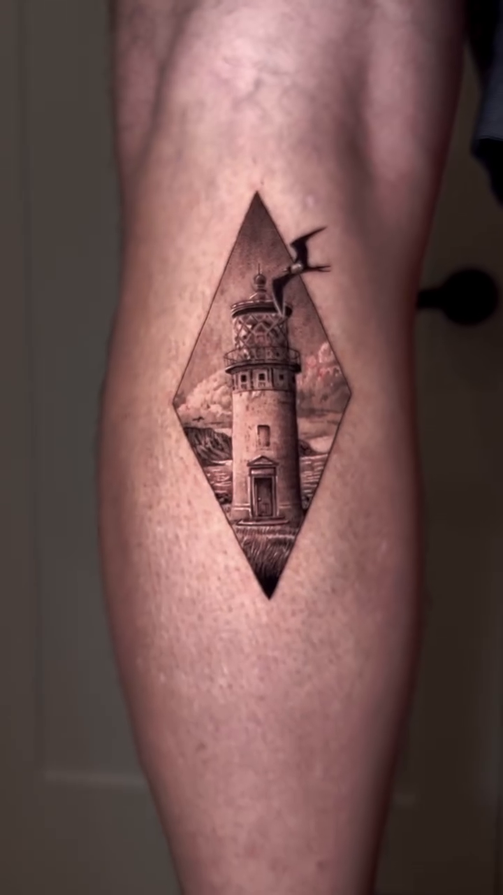 Lighthouse scene realism tattoo by Oxana