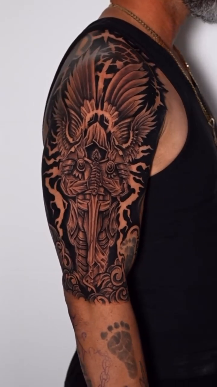 Angelic warrior with sword dark realism tattoo by Dharma.tattoo