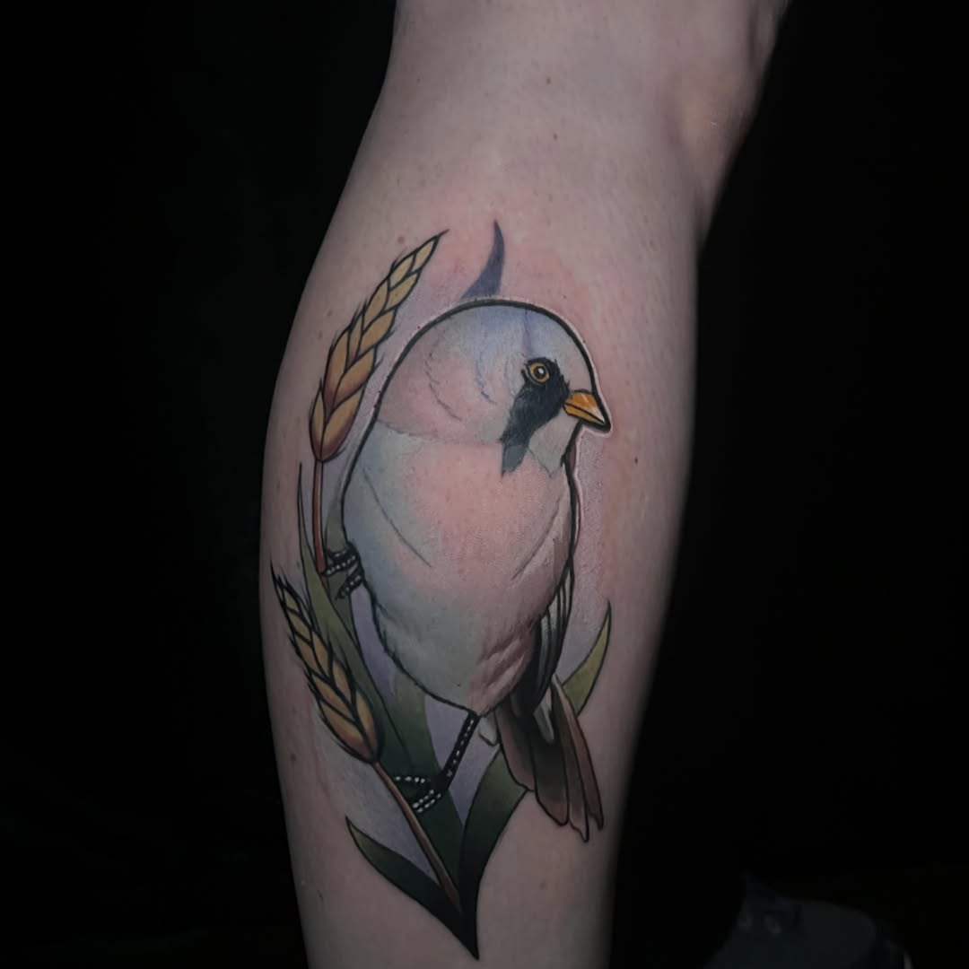 Bird and wheat watercolor tattoo on the forearm by Emily Walker