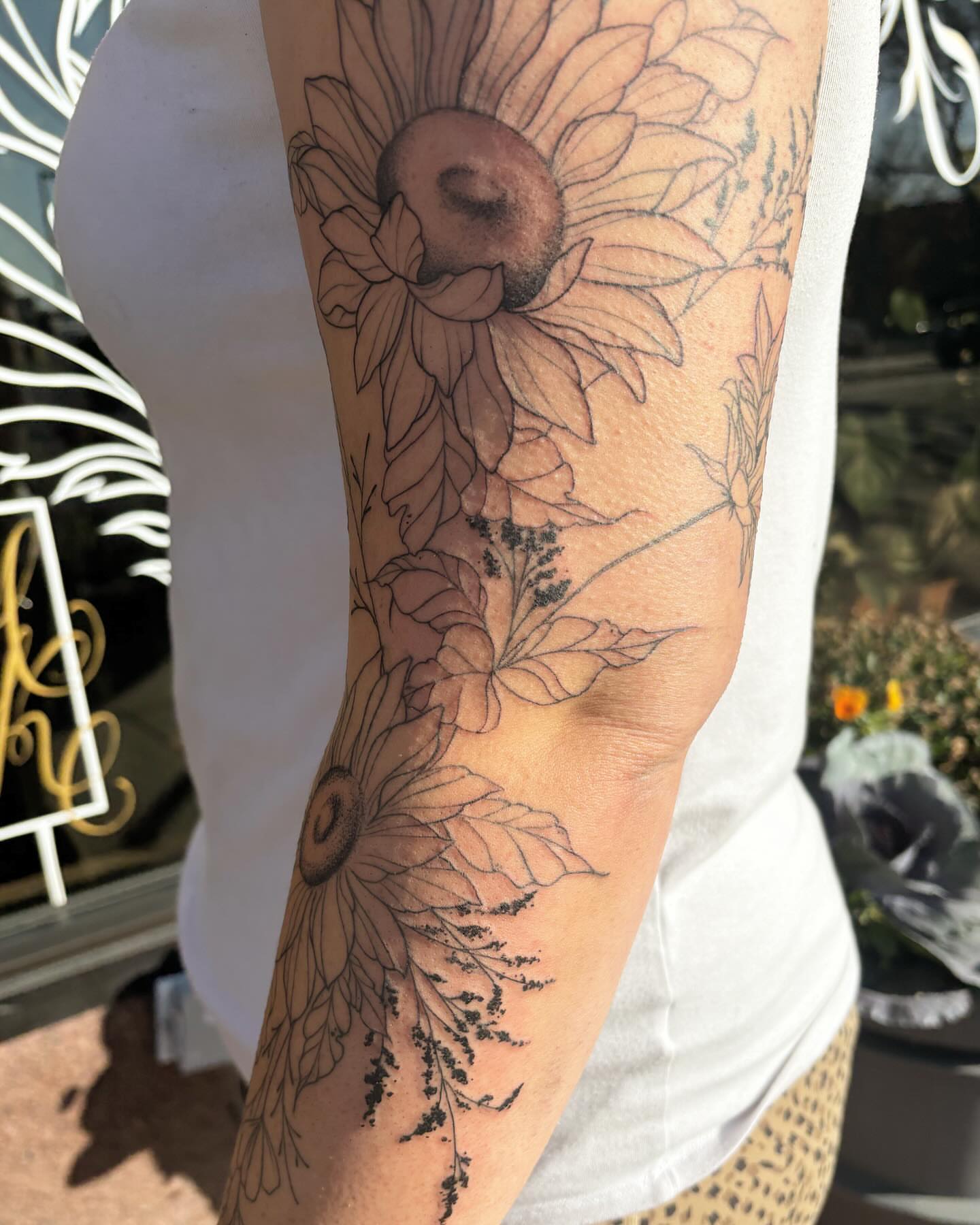 Sunflower black and grey tattoo on the forearm by Anna Kathleen, Des Moines, Iowa