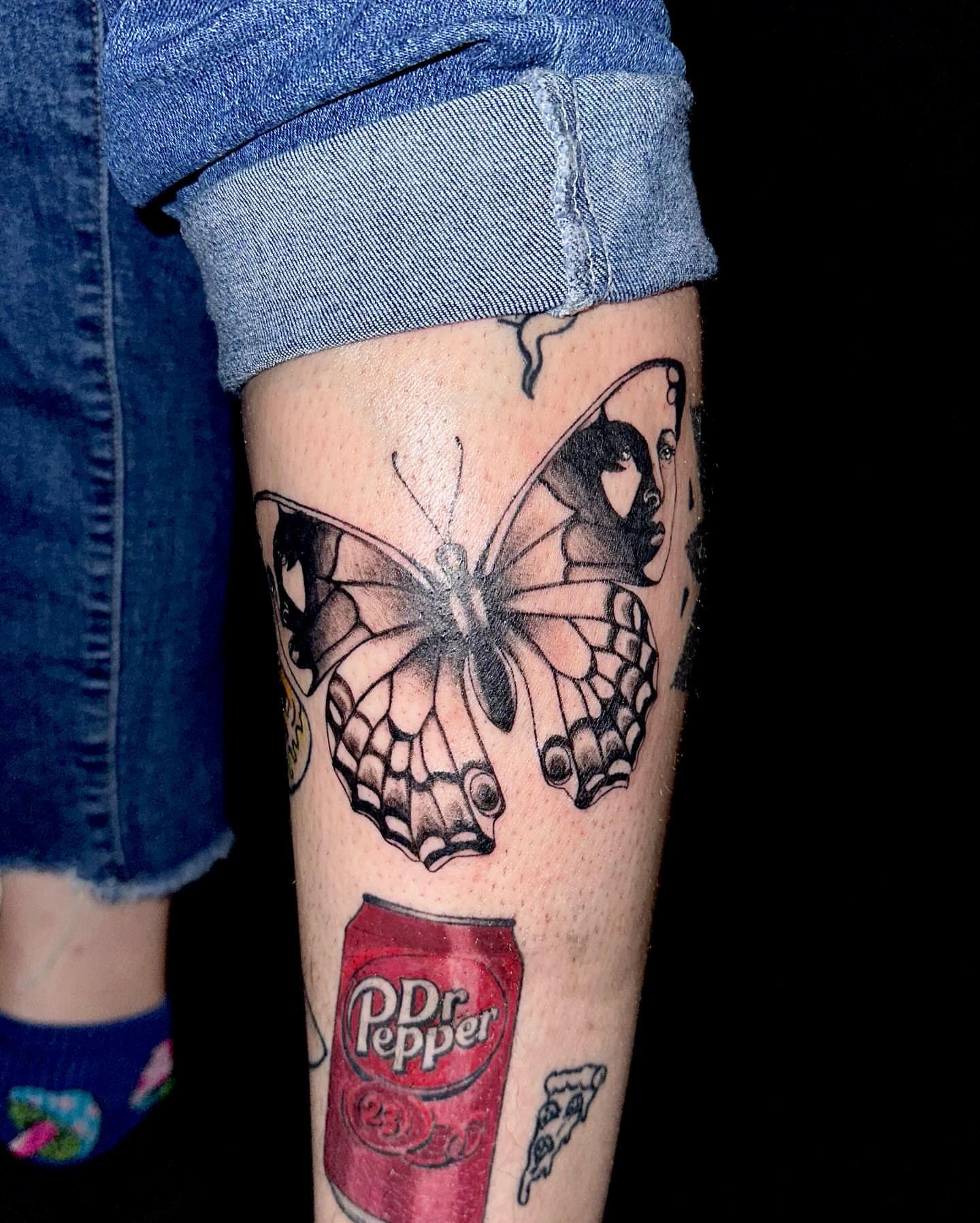 Butterfly and woman black and grey tattoo on the forearm by Marie Novotny, Lakewood, Ohio