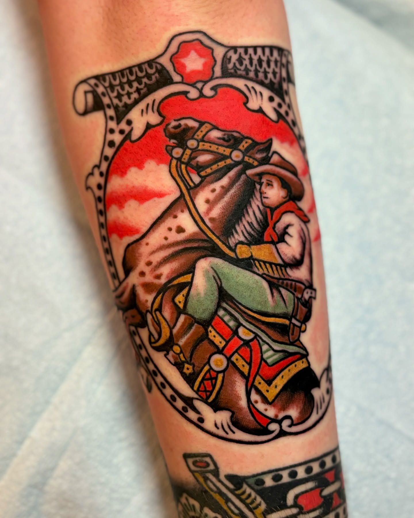 Cowboy riding horse American traditional tattoo on the forearm by Weston Imhoff
