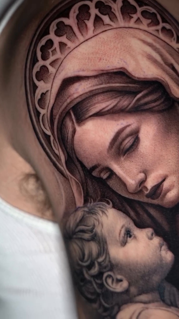Virgin Mary and child realism tattoo by Risa