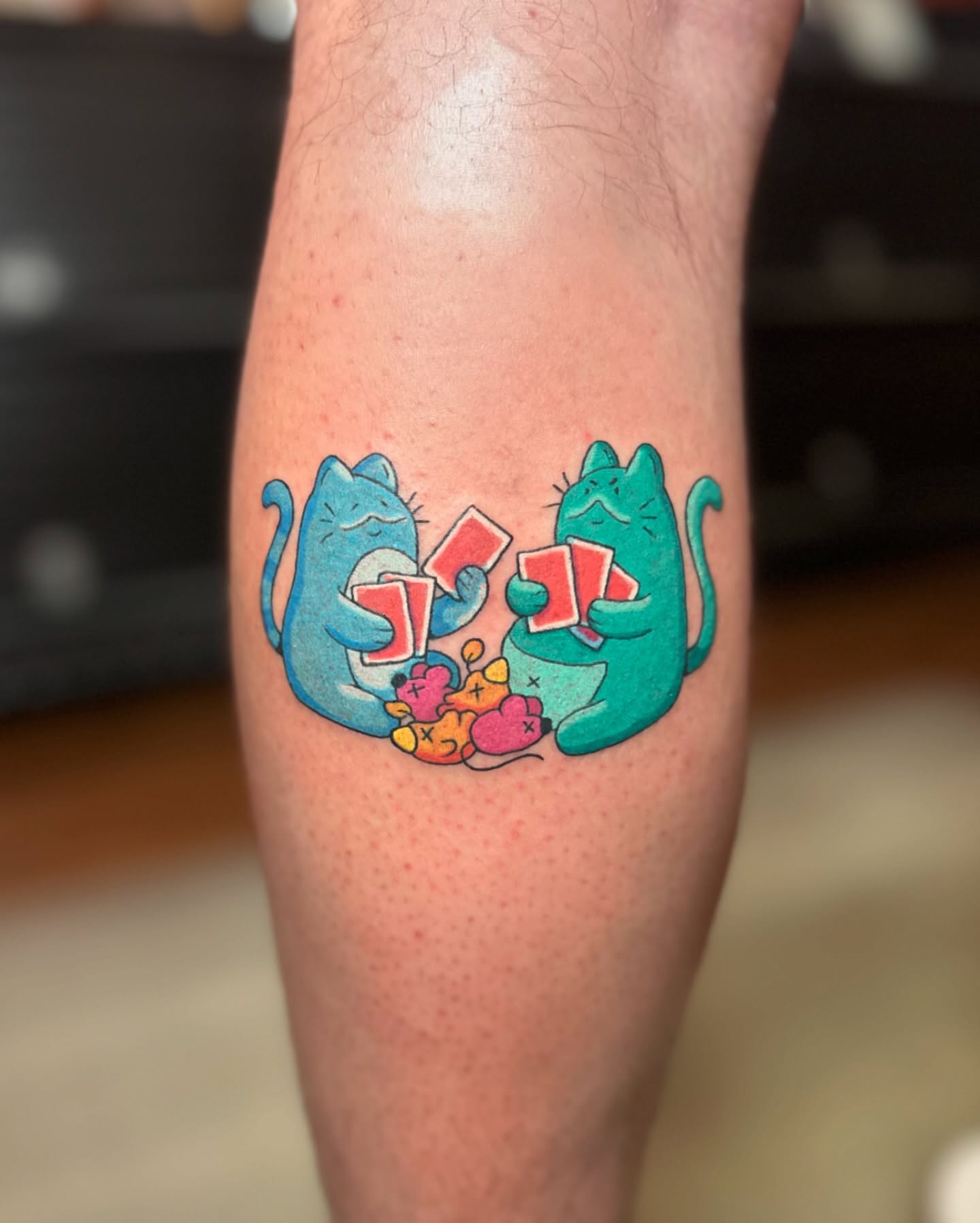 Playing cats dotwork tattoo on the forearm by Kellie Burch
