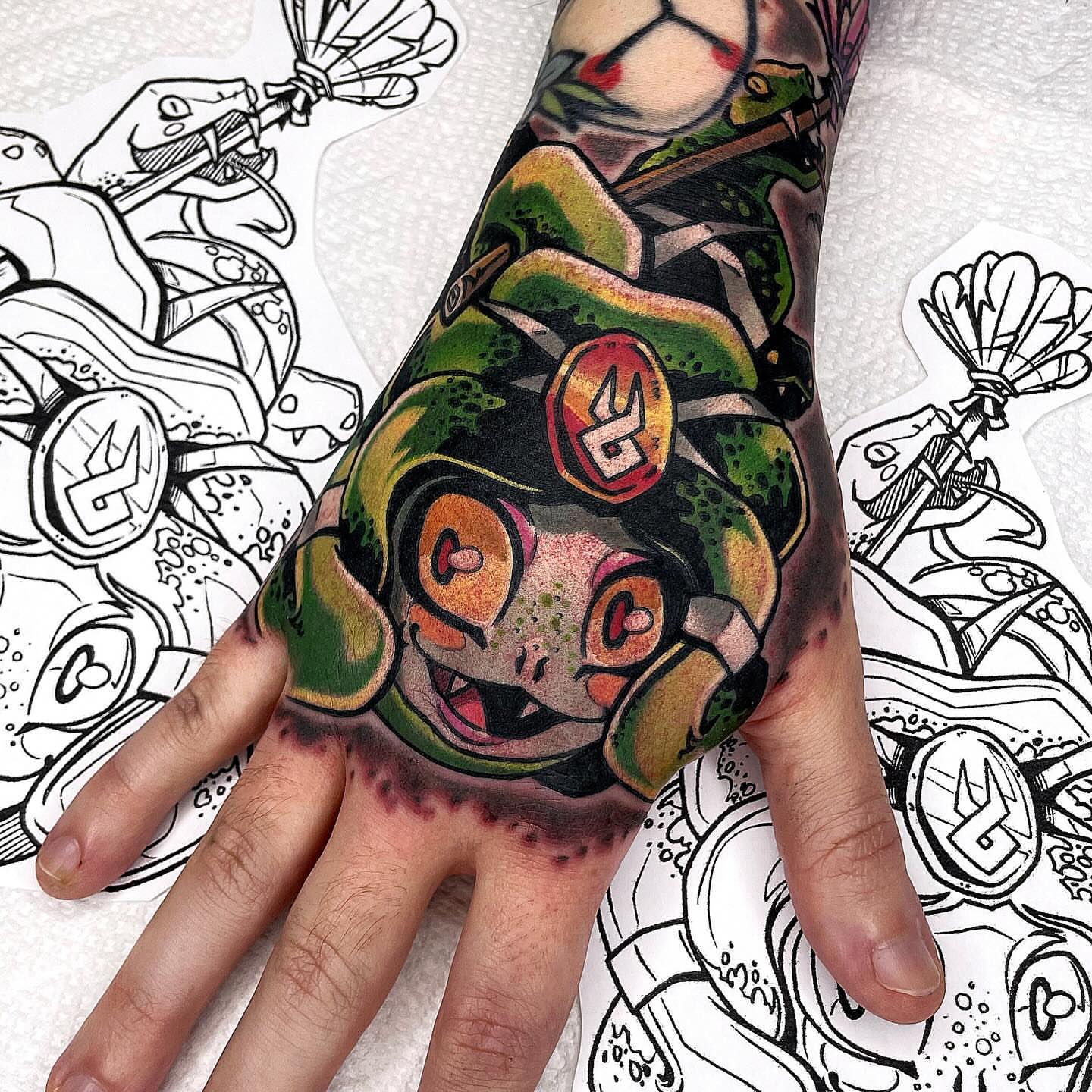 Frog American traditional tattoo on the hand by Bold Anime Tattoos