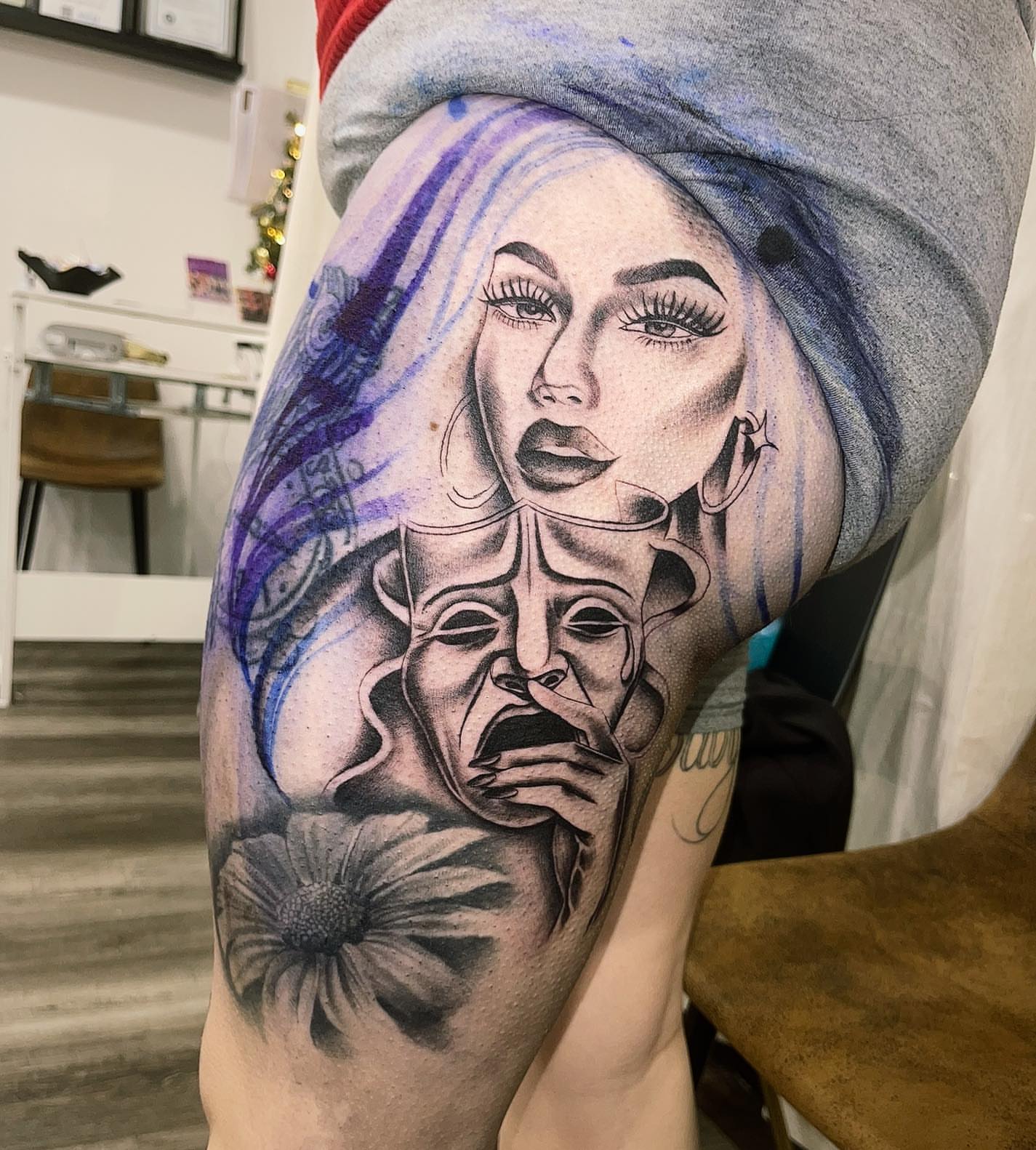 Woman with mask realism tattoo on the thigh by Las Vegas Tattoo Artist