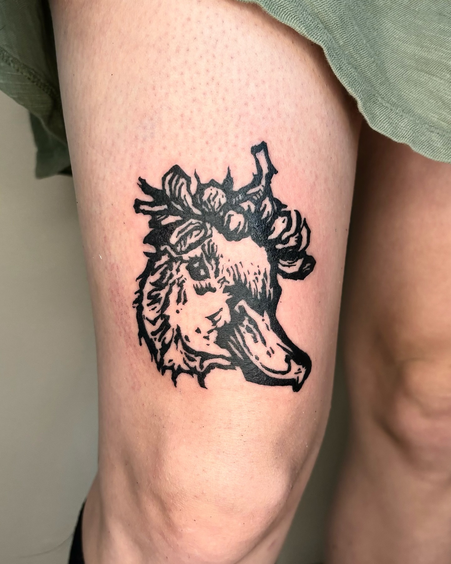 Wolf black and grey tattoo on the thigh by Wren Cavanaugh Tattoos, Seattle, Washington