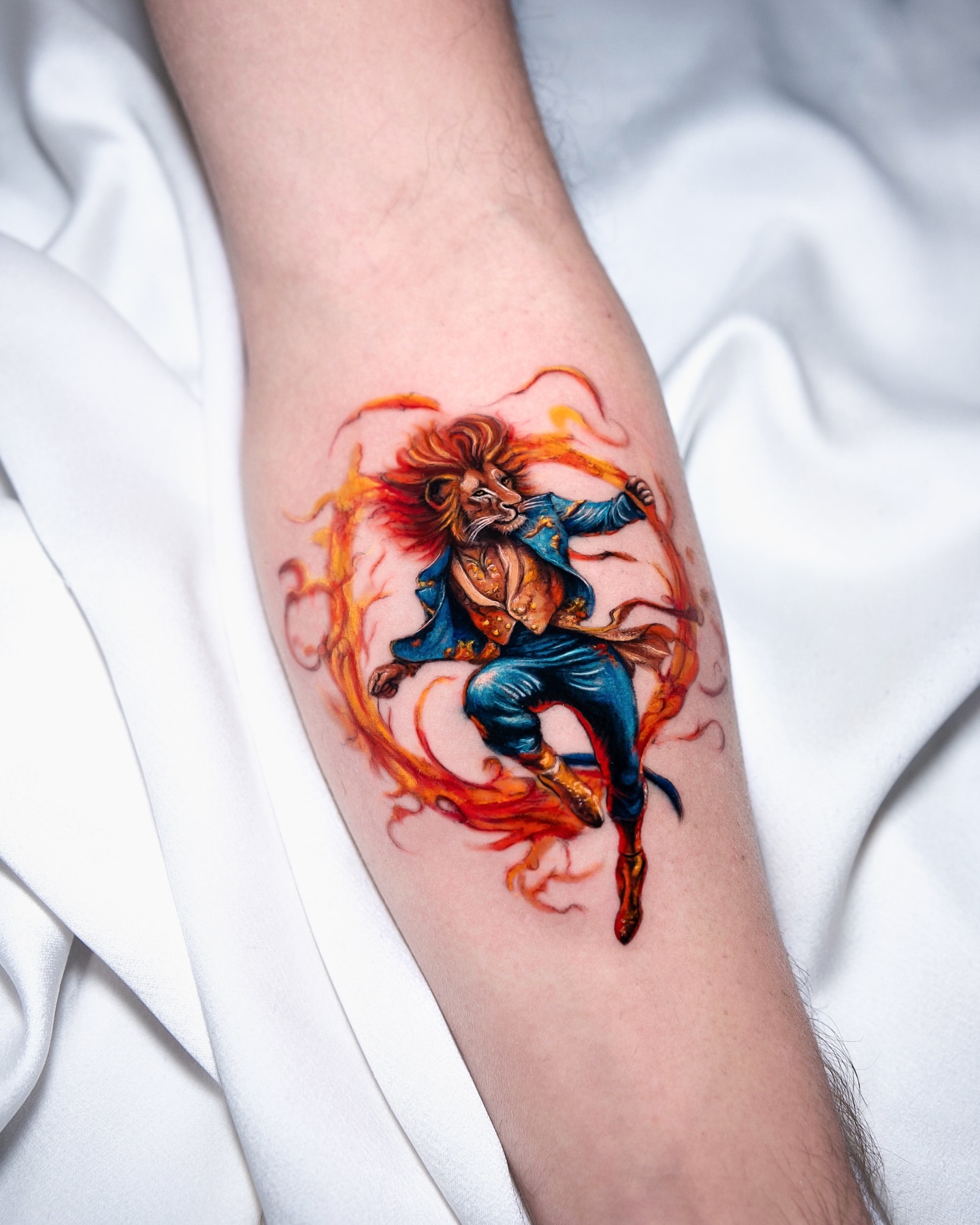 Lion in flames new school tattoo on the forearm by serenay akçiçek