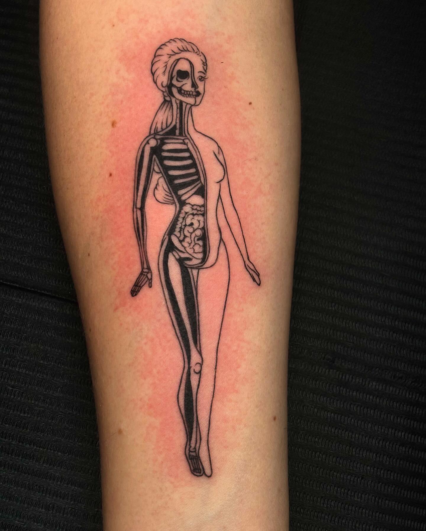 Human skeleton black and grey tattoo on the forearm by Gabby Finearts