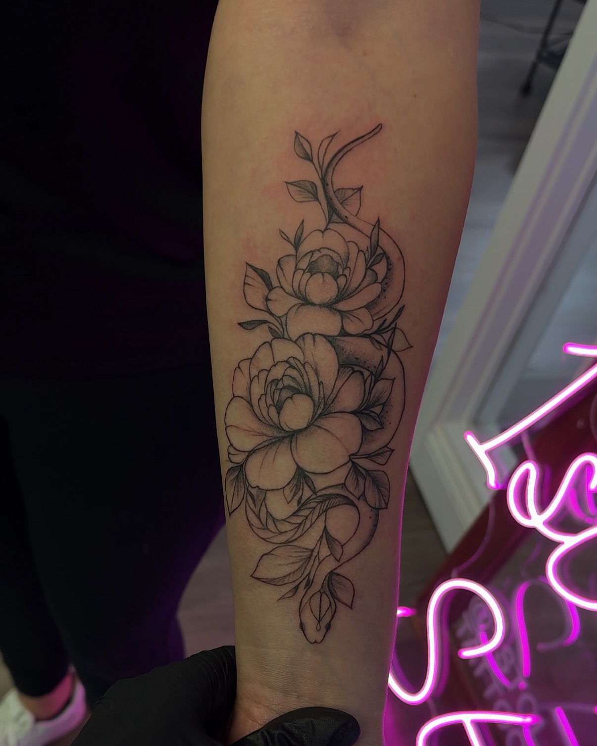 Floral bouquet black and grey tattoo on the forearm by Kris Tattoo Chicago