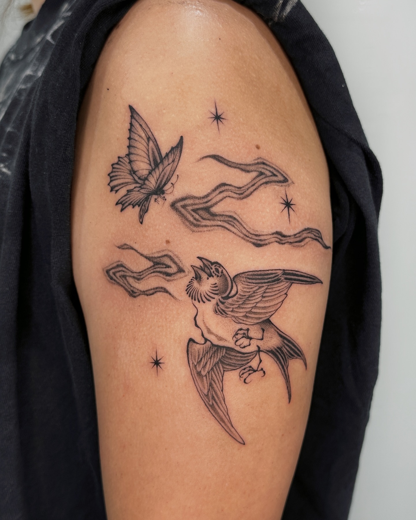 Bird and butterfly black and grey tattoo on the shoulder by abigail 🌸