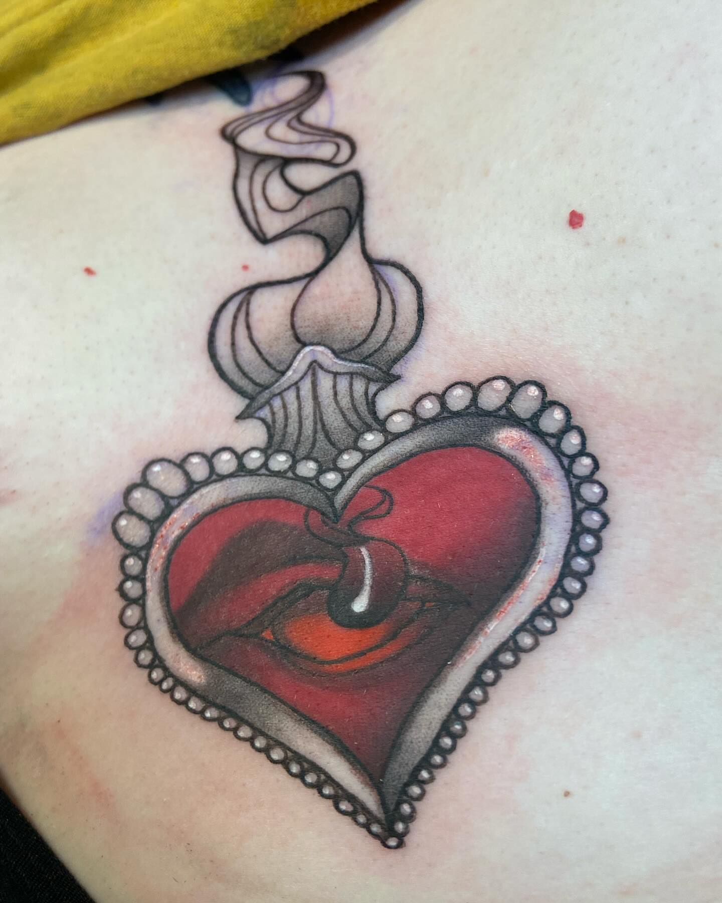 Smoking heart tattoo by Slade Nowicki