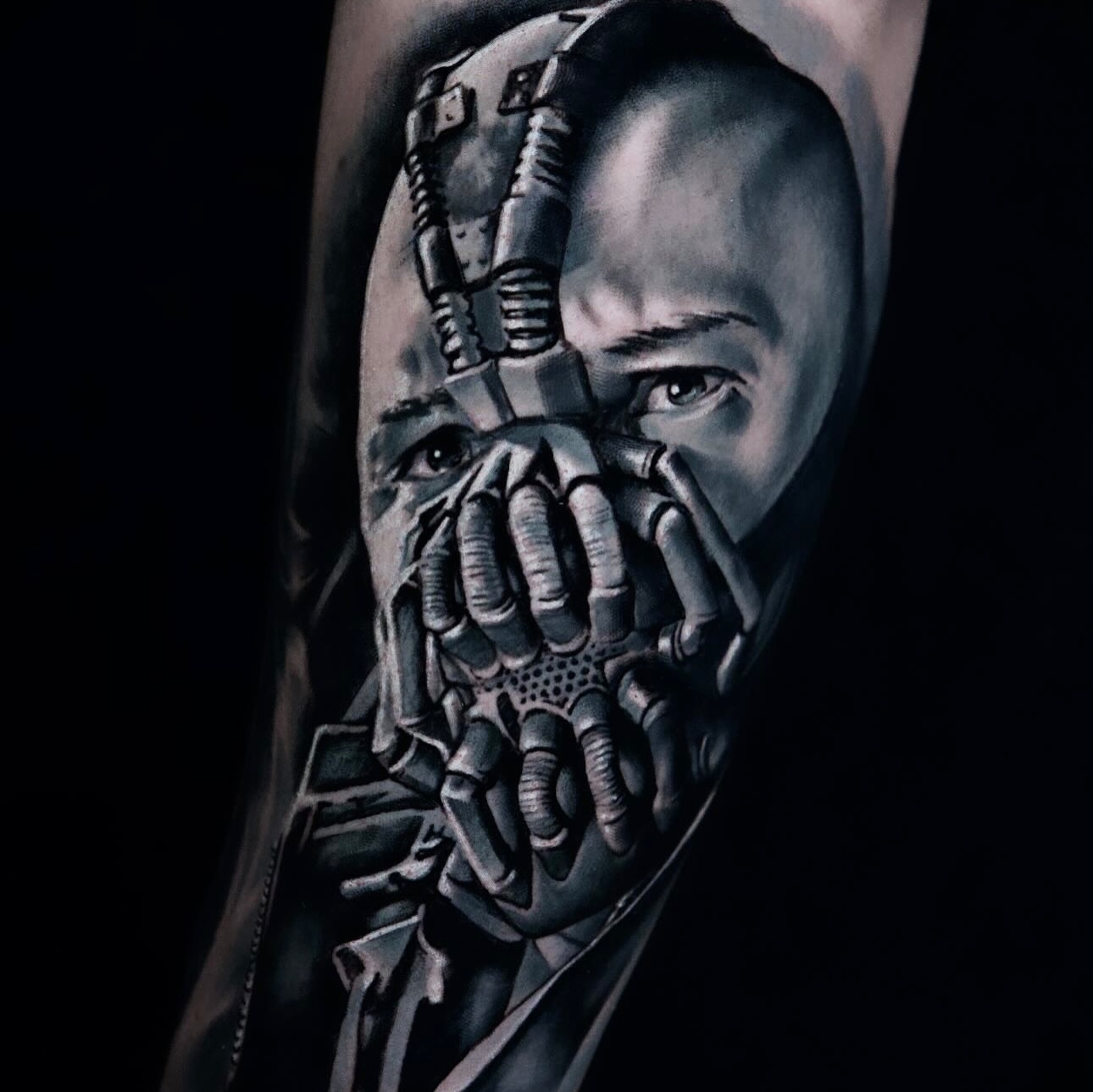 Bane mask dark realism tattoo on the forearm by Dayron Gonzalez