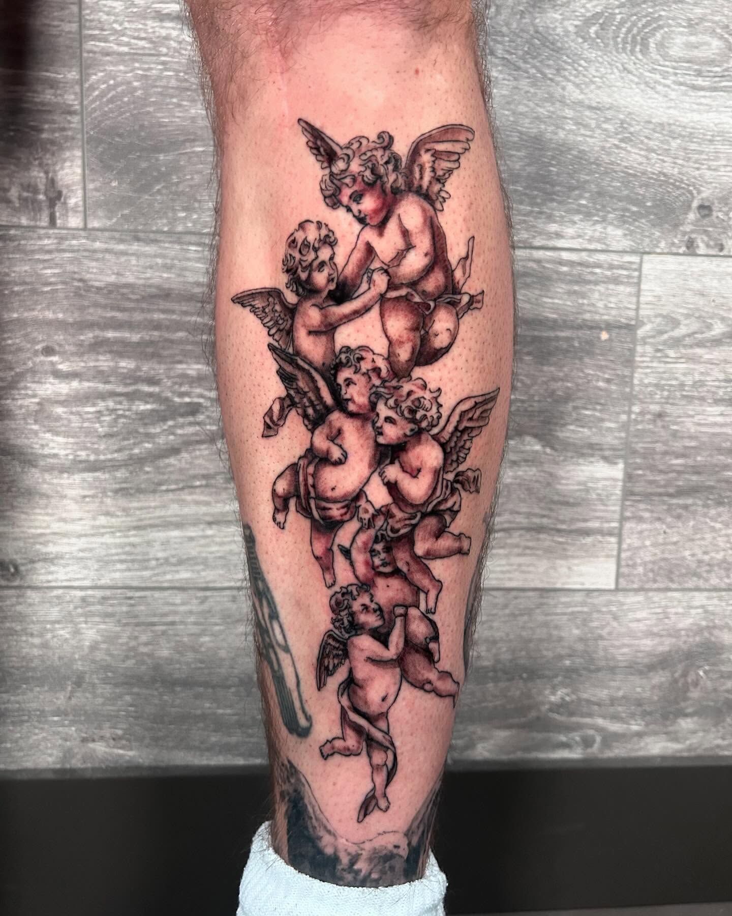 Cherubs neo-traditional tattoo on the calf by Kipling Mcclellan