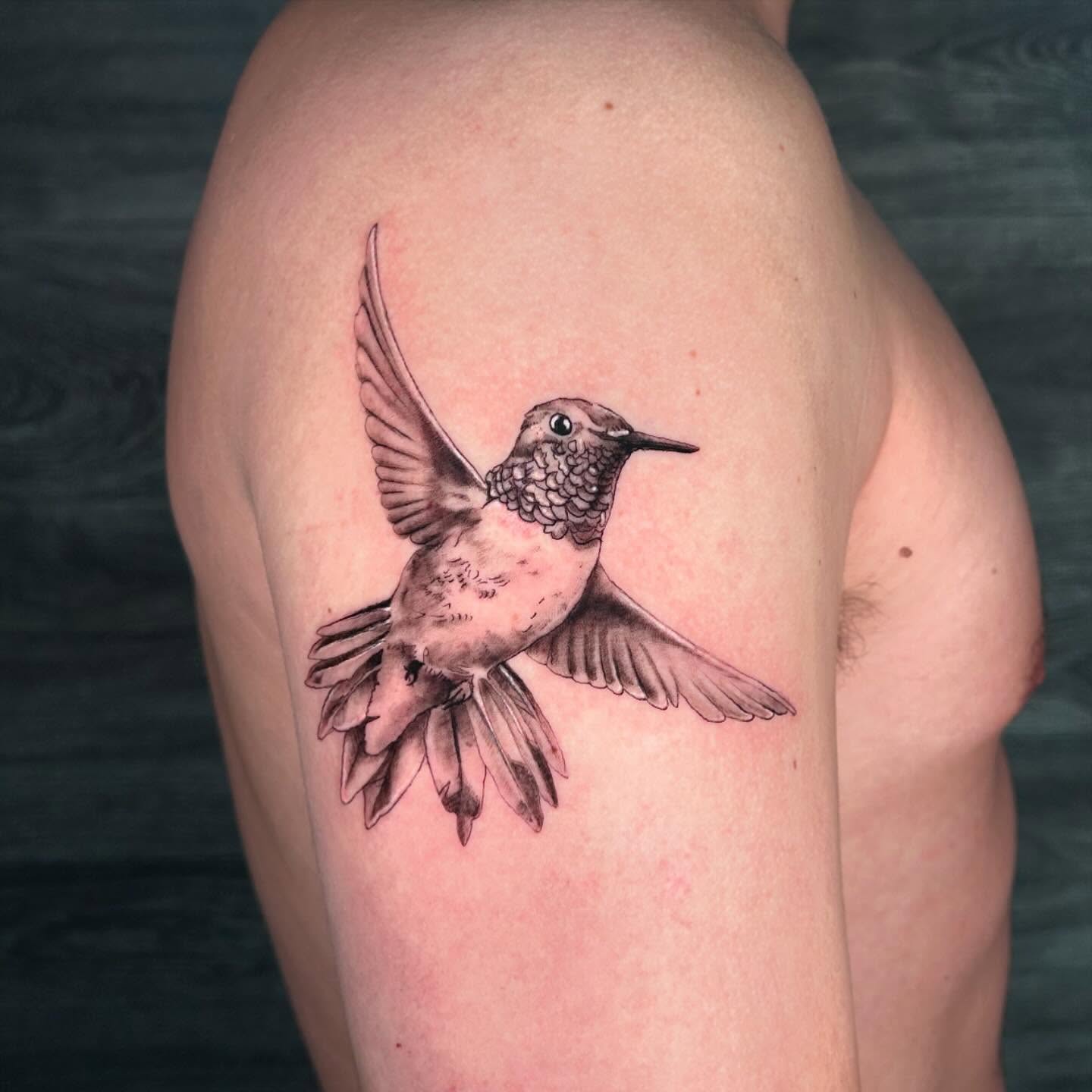 Hummingbird realism tattoo on the thigh by Kipling Mcclellan