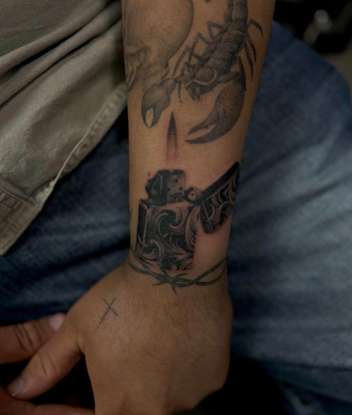 Scorpion and lighter black and grey tattoo on the forearm by Alexa Camacho