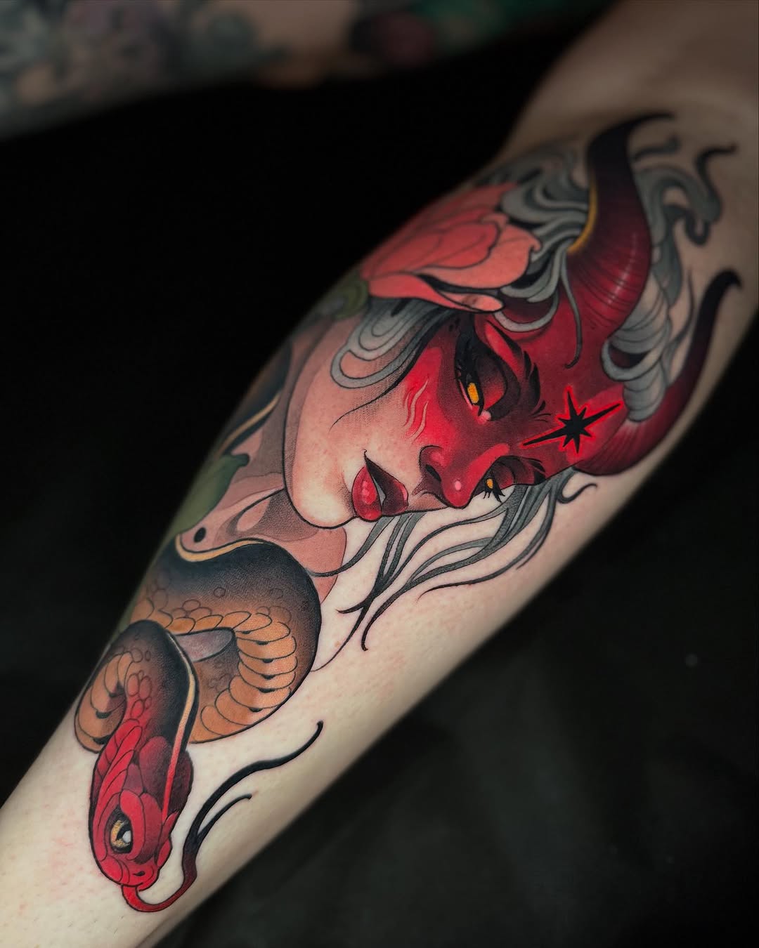 Demon face and snake neo-traditional tattoo on the forearm by Freddie Brown, Lombard, IL