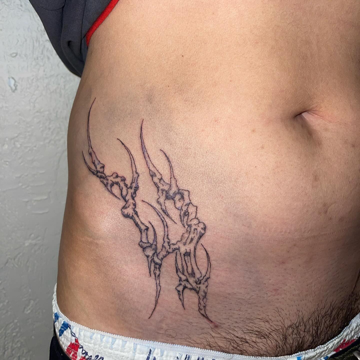 Bone structure black and grey tattoo on the ribs by @initiationoftorture