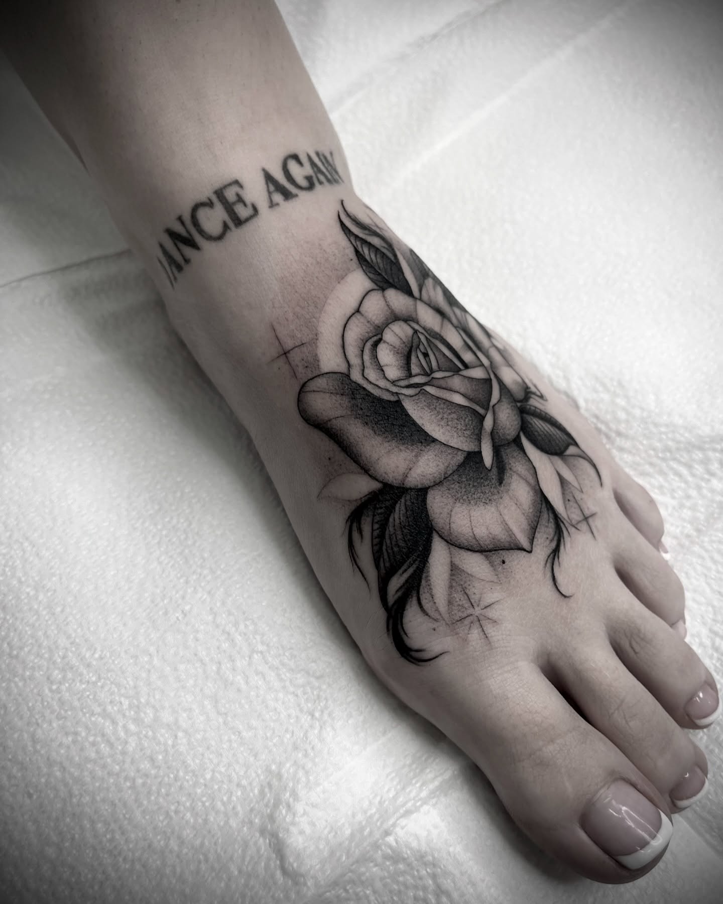 Rose black and grey tattoo on the foot by Martha Gual π€ East ATX Tattooer
