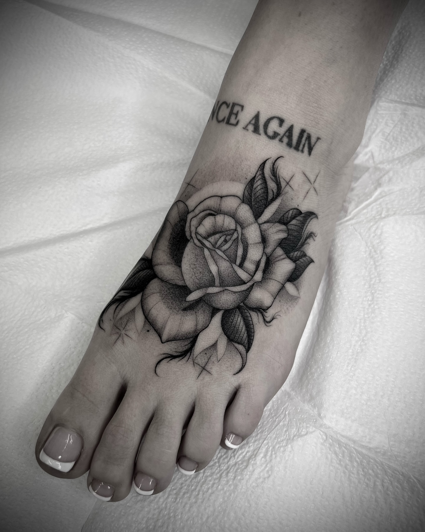 Rose black and grey tattoo on the foot by Martha Gual π€ East ATX Tattooer
