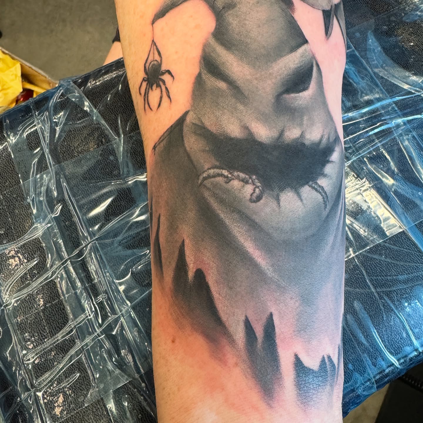 Demon dark realism tattoo on the forearm by Garrett Rautio