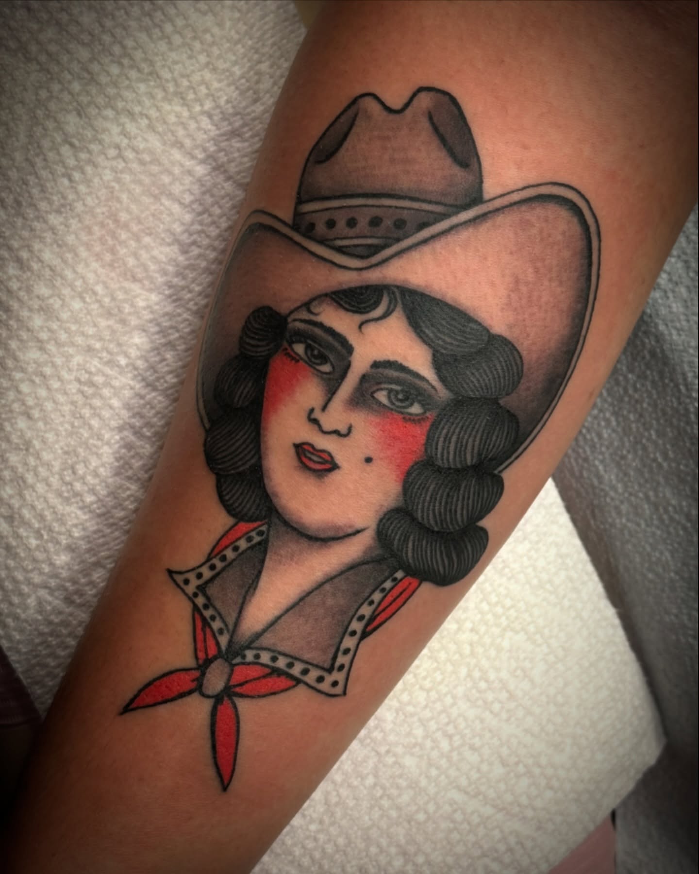 Cowgirl portrait American traditional tattoo on the forearm by Joseph Ayala