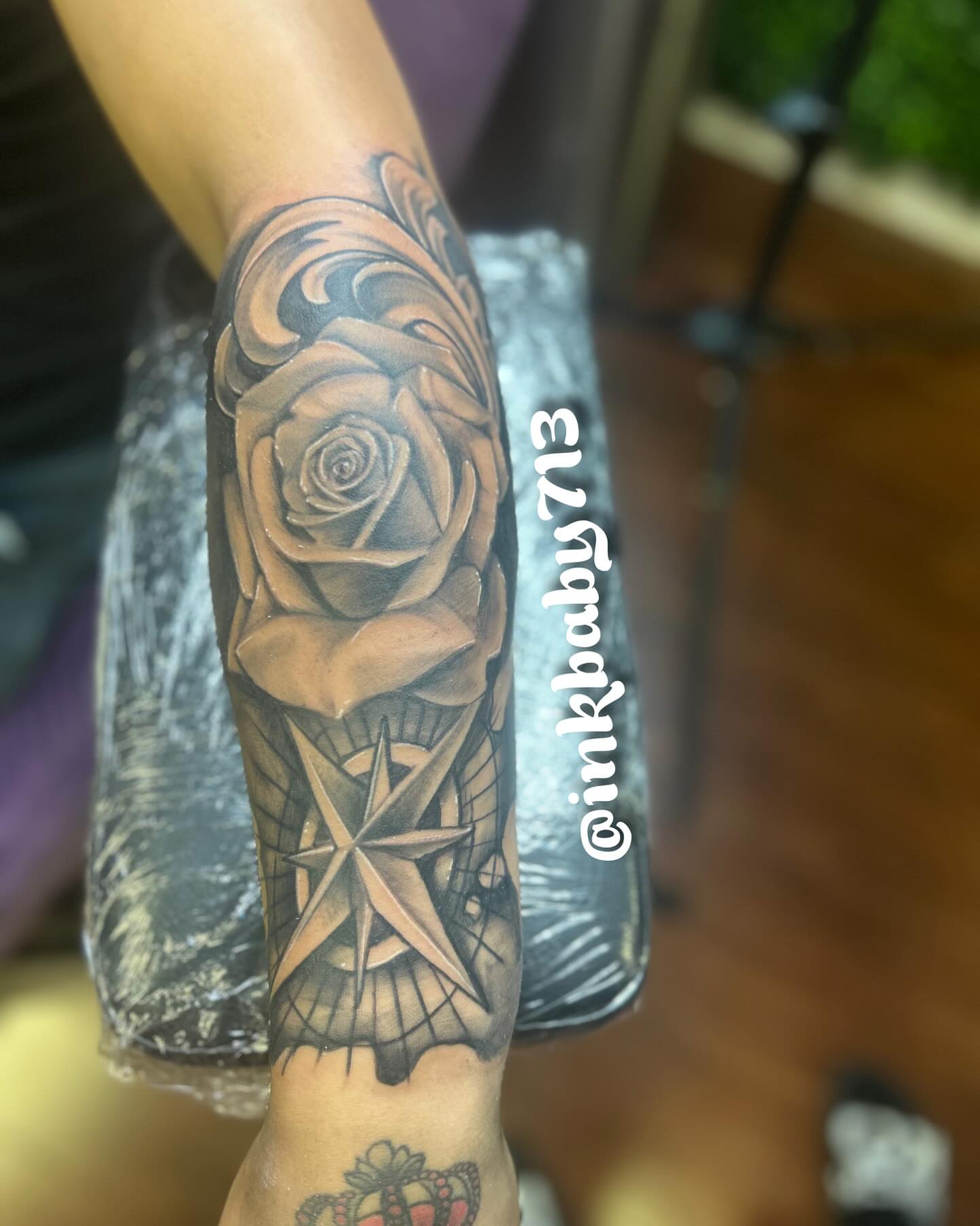 Rose and compass realism tattoo on the forearm by Ayanna Luna