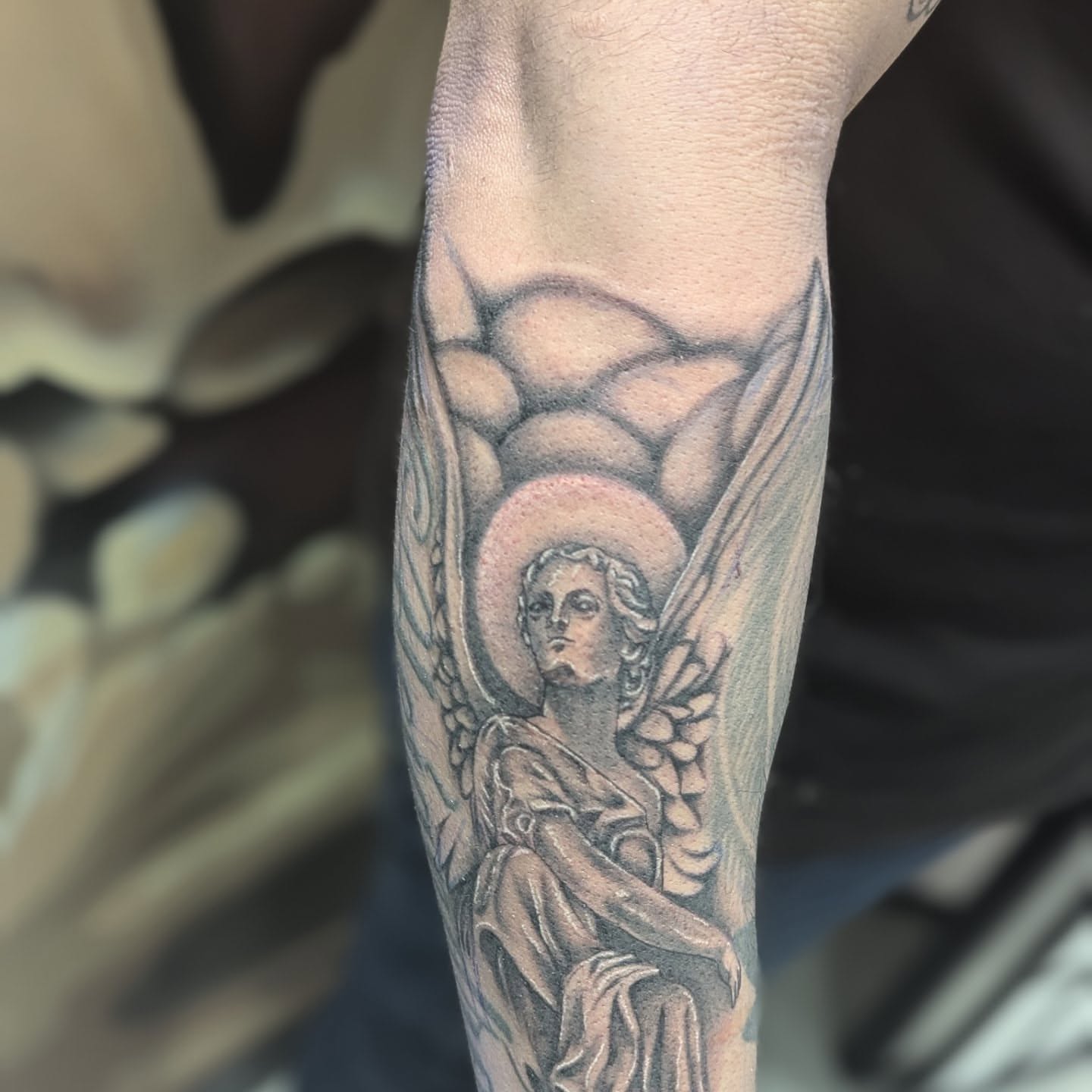 Angel black and grey tattoo on the forearm by Claudia Isabel Roman, El Paso, Texas