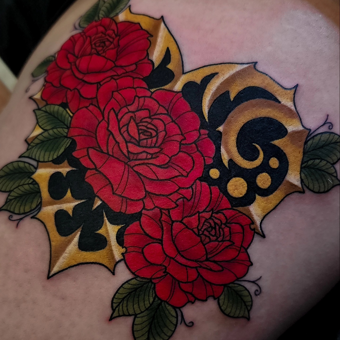 Roses American traditional tattoo on the shoulder by Mariah Giovanna Hodgens