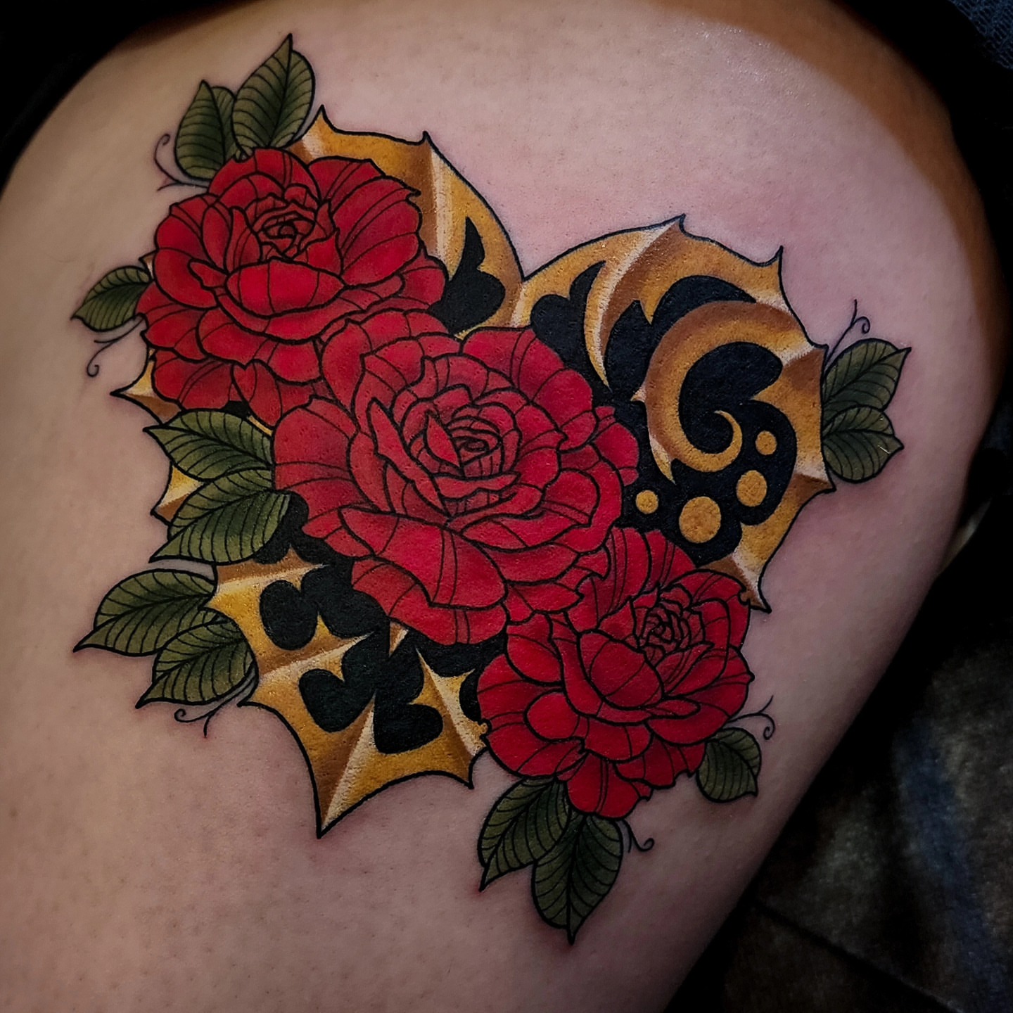 Roses American traditional tattoo on the thigh by Mariah Giovanna Hodgens