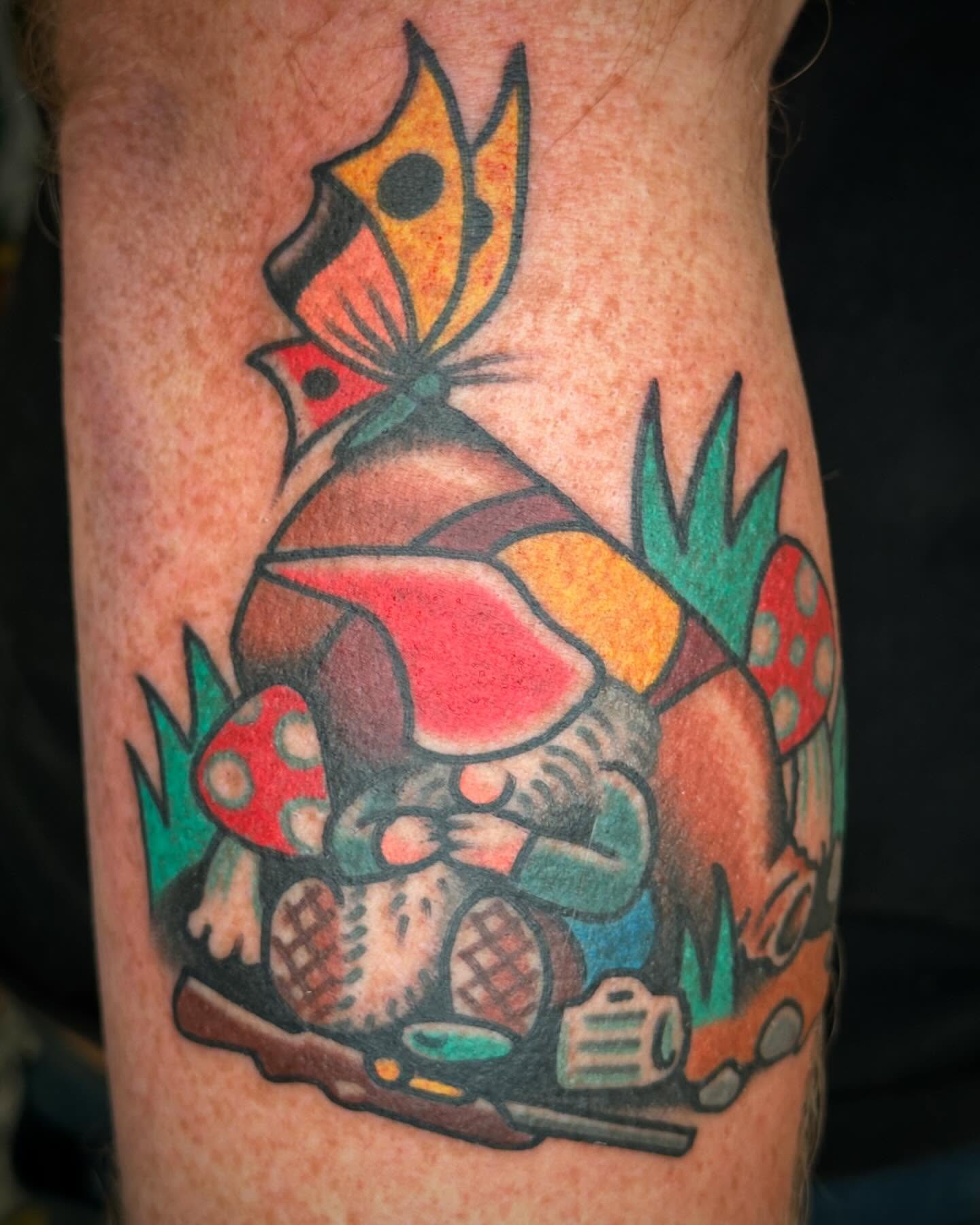 Gnome and mushrooms American traditional tattoo on the forearm by Big Al