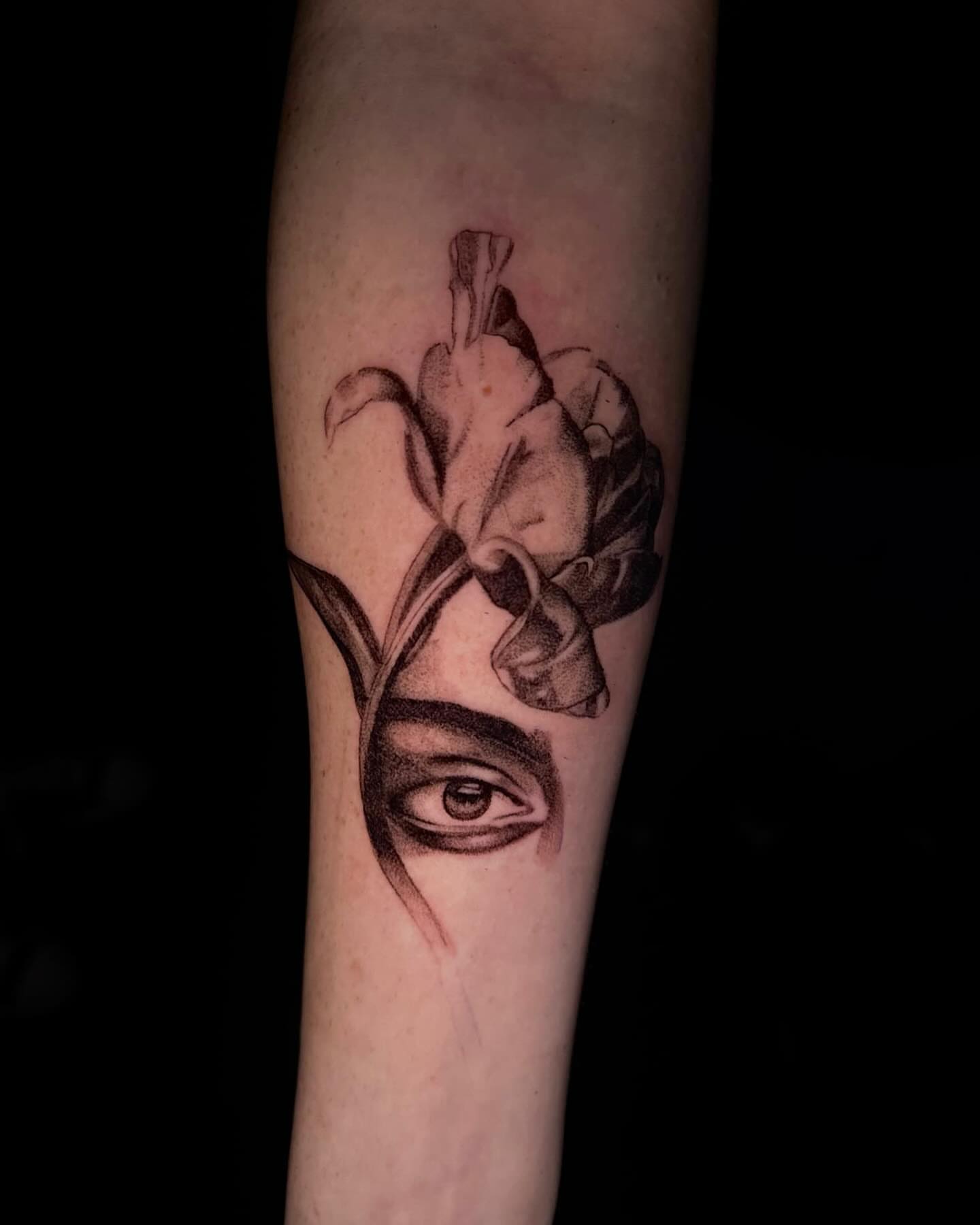 Iris and eye dotwork tattoo on the forearm by V