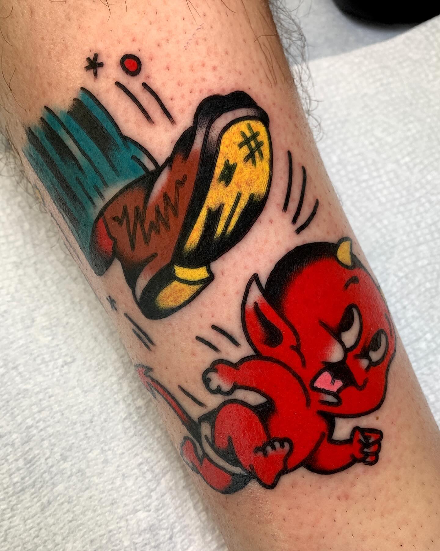Devil and crayon American traditional tattoo on the forearm by Zachary - Traditional Tattoo Artist