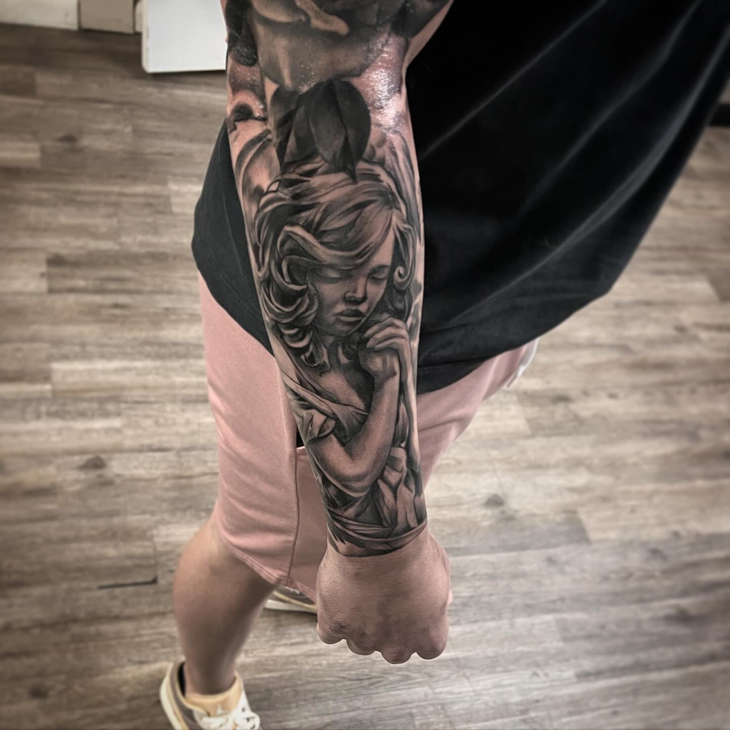 Woman praying realism tattoo on the forearm by Jared McGee