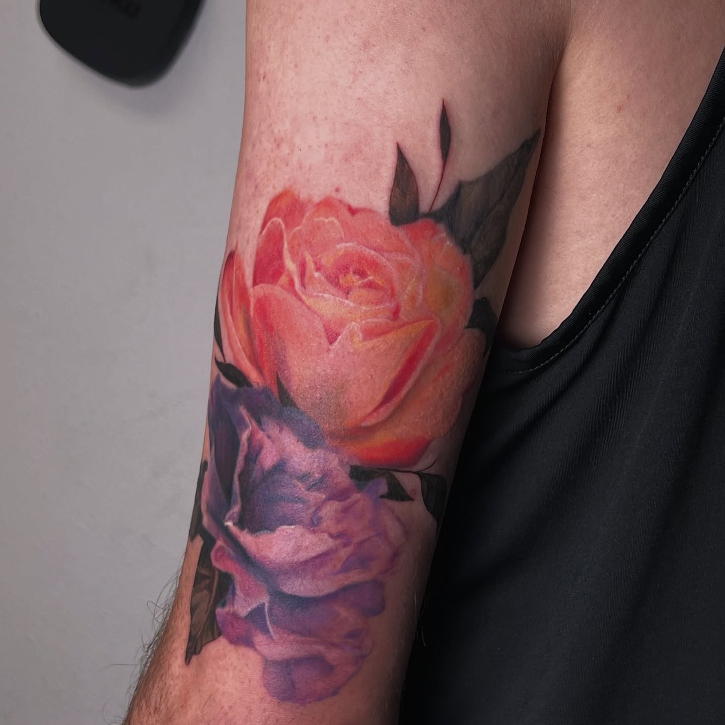 Roses realism tattoo on the forearm by Jordan